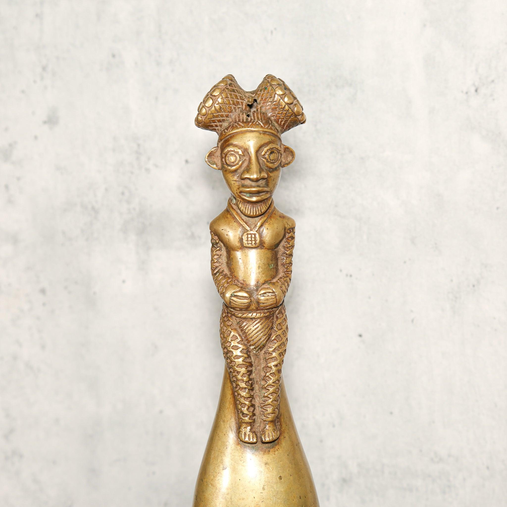 Bamum Brass Bell from Cameroon as a home decor idea standing on a table on a close up