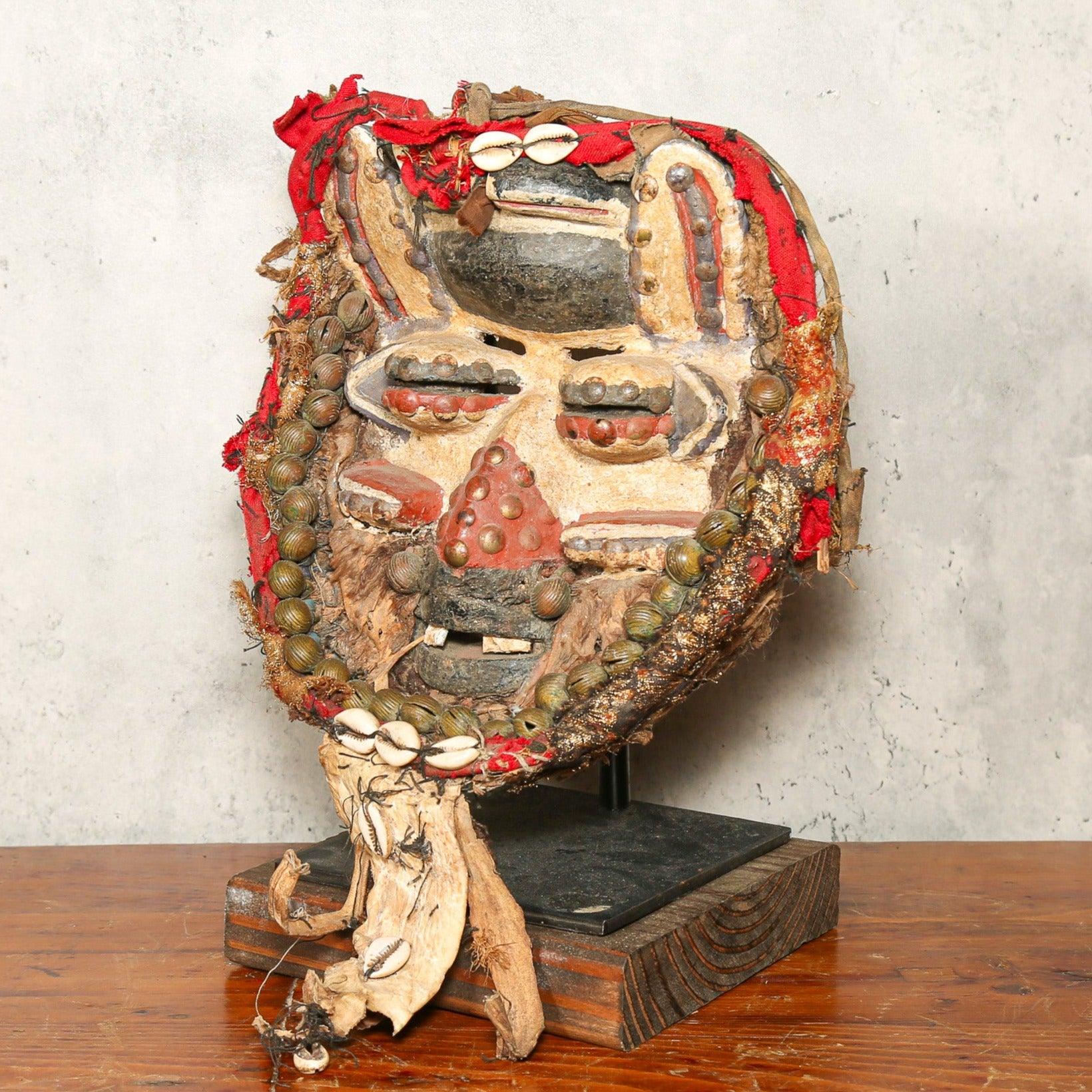 Dan Mask from Côte d’Ivoire as a home decor idea on a stand skewed to the right