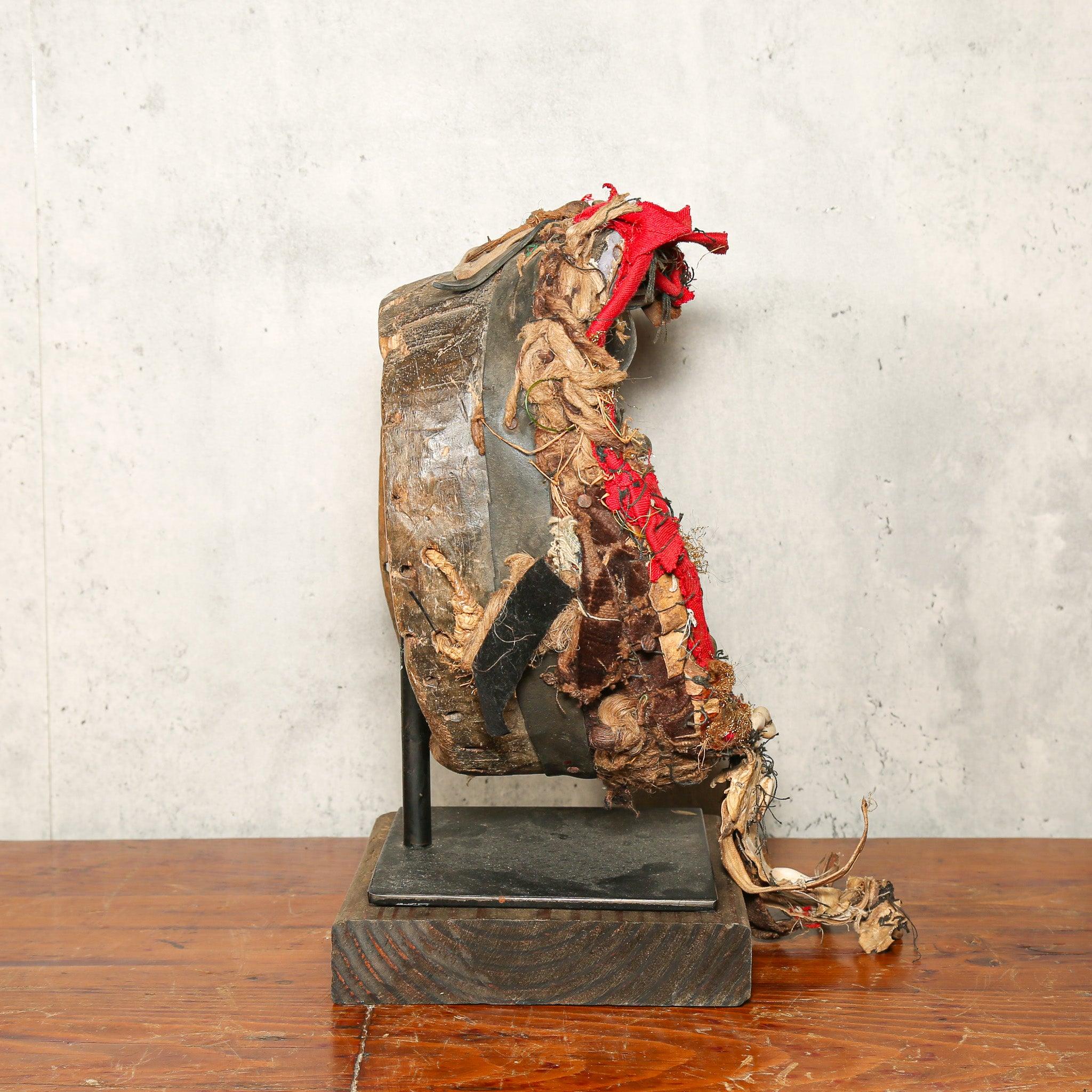 Dan Mask from Côte d’Ivoire as a home decor idea on a stand showing right side