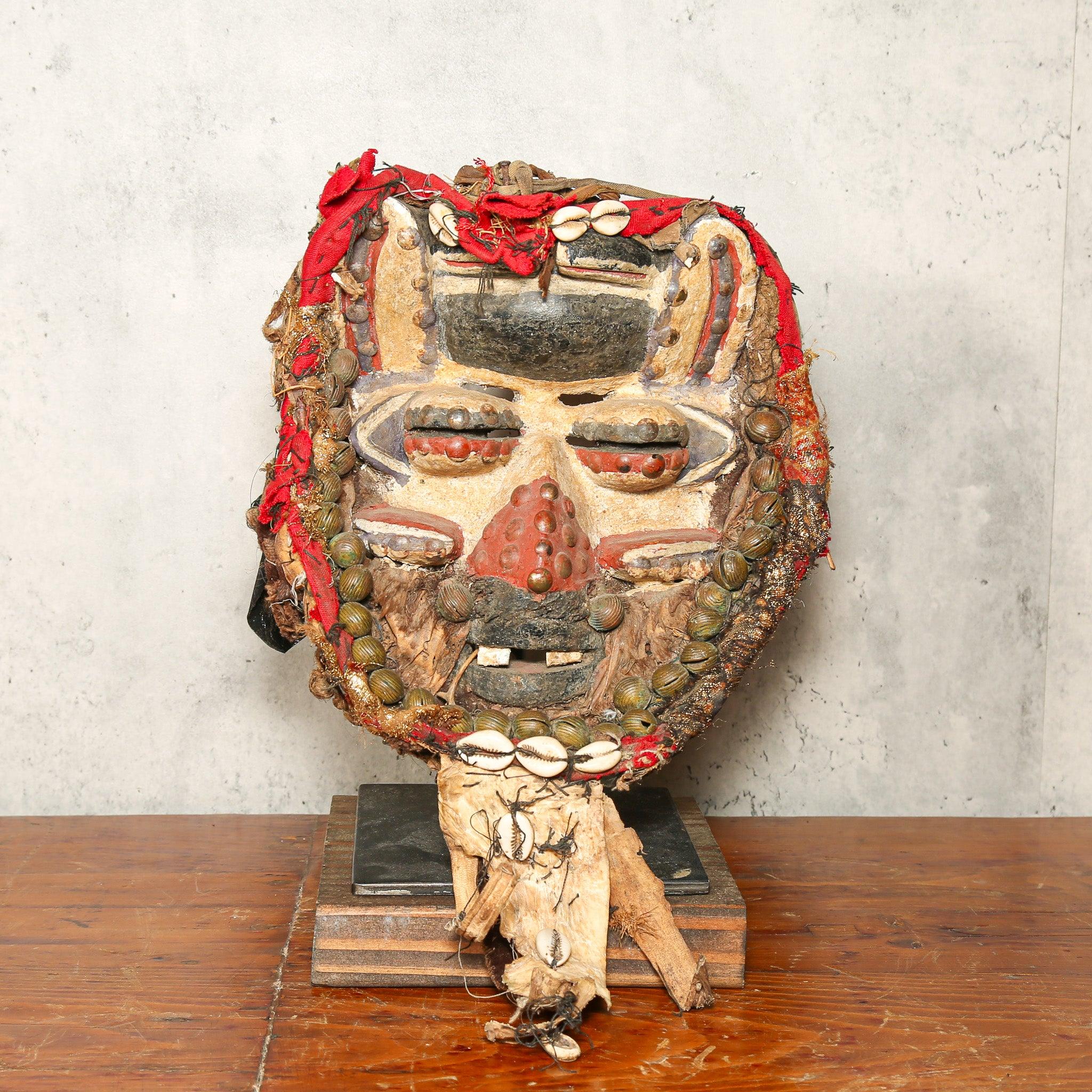 Dan Mask from Côte d’Ivoire as a home decor idea on a stand showing front side