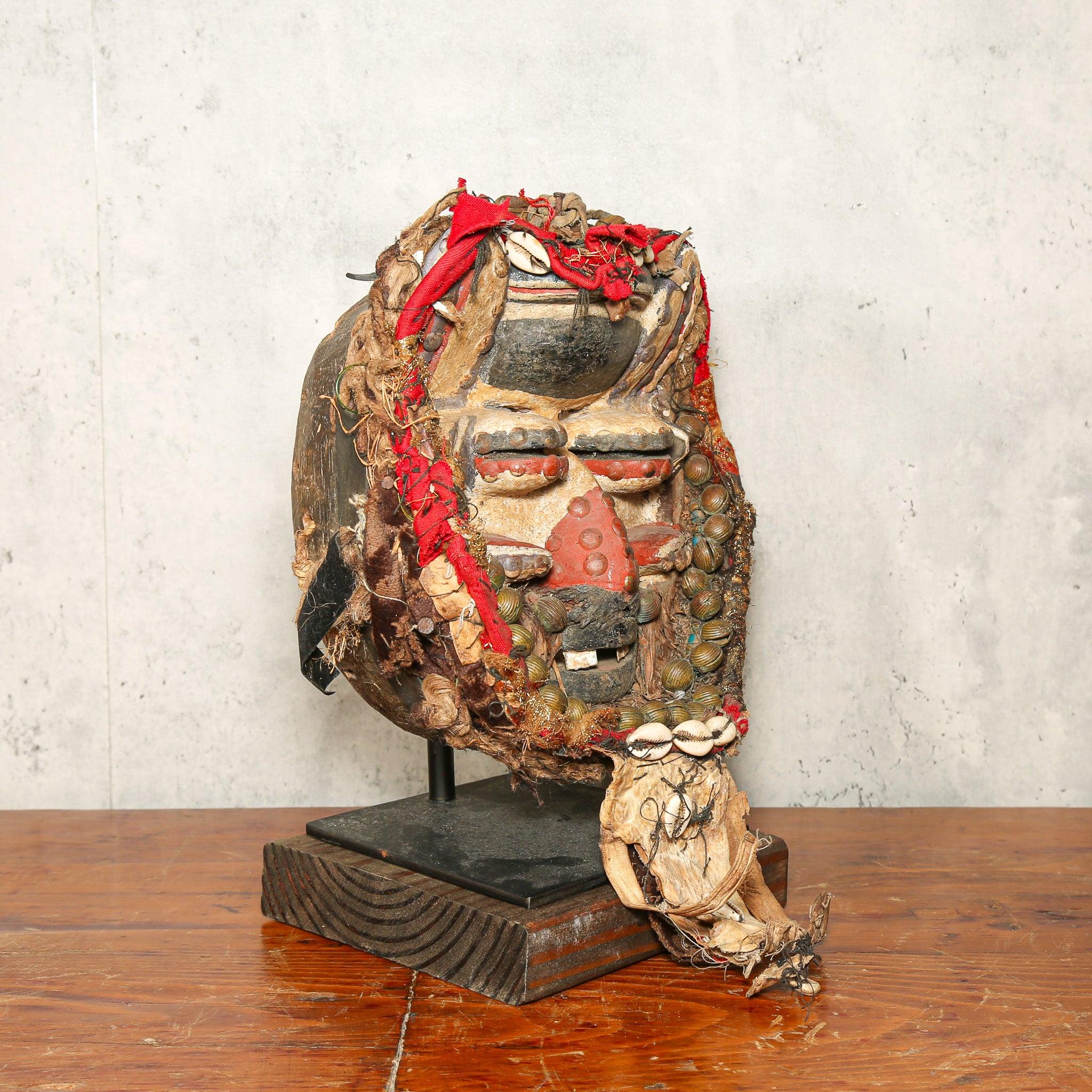 Dan Mask from Côte d’Ivoire as a home decor idea on a stand skewed to the left