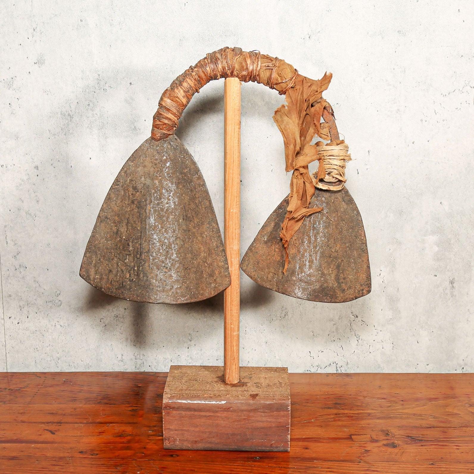 Handmade Iron Bamileke Double Gong from Cameroon on a table