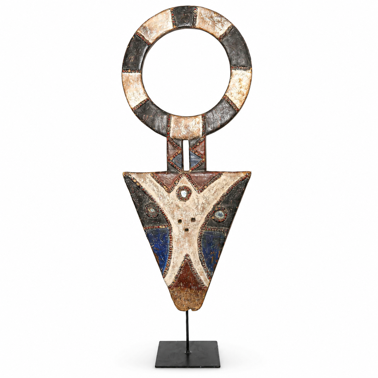 Decorative piece with circular top and triangular bottom on a stand against a white background