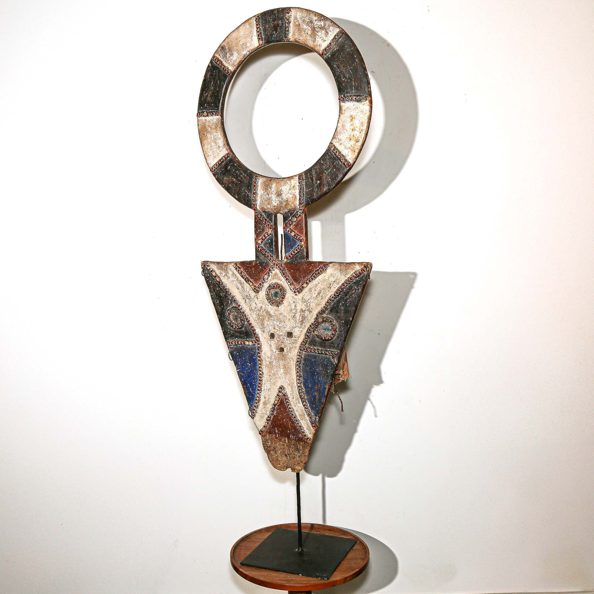 Bedu Plank Mask from Ivory Coast on white living room wall