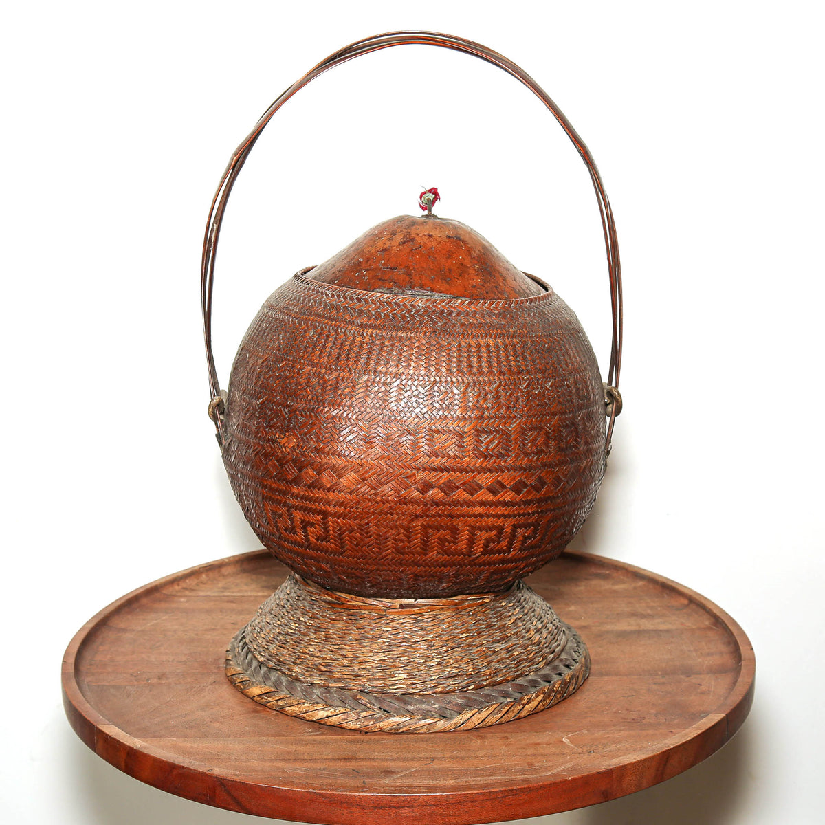 Antique woven gourd basket from Southern Africa with finely woven plant fiber and handle