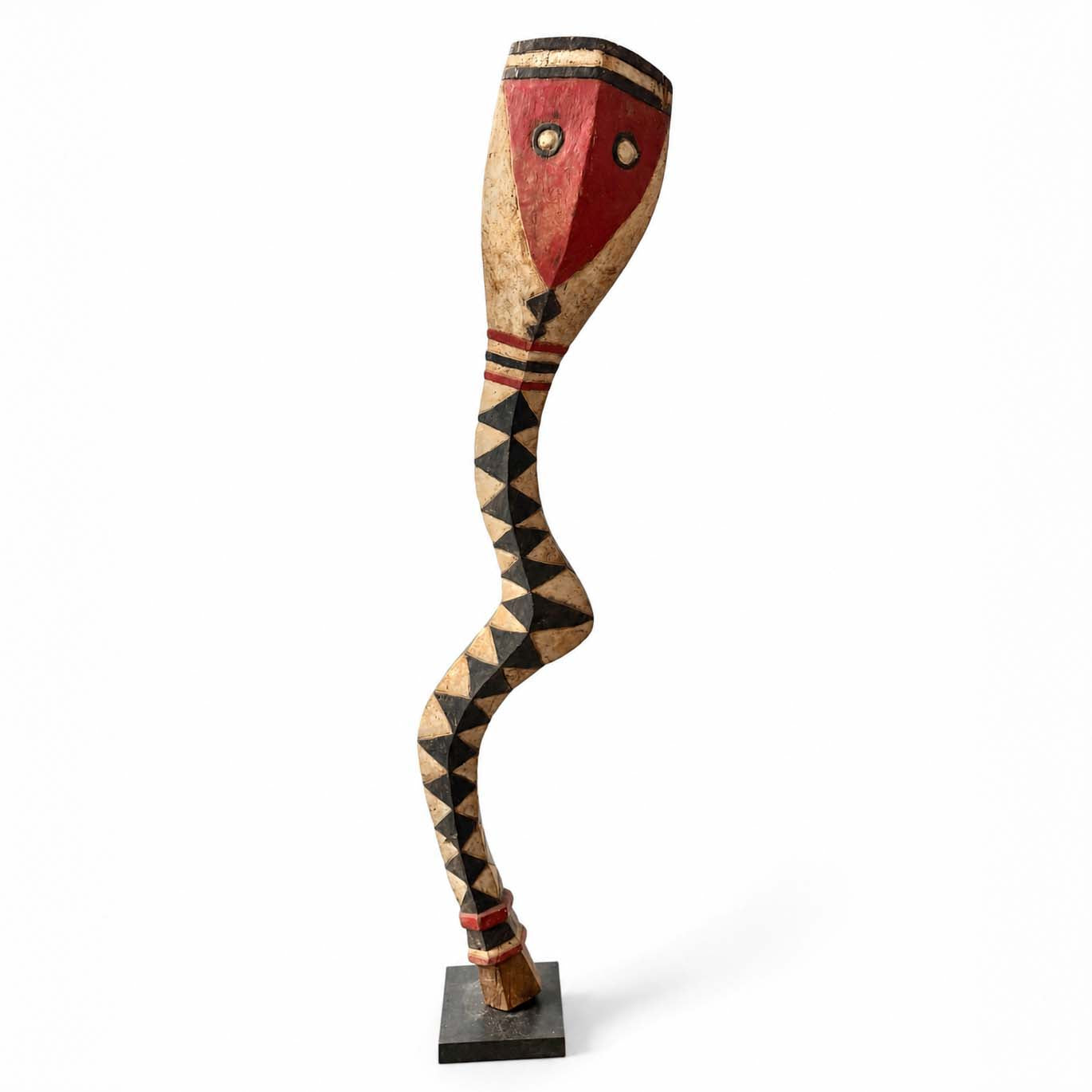 Tribal snake sculpture from Africa with a stylized face and geometric patterns on a white background