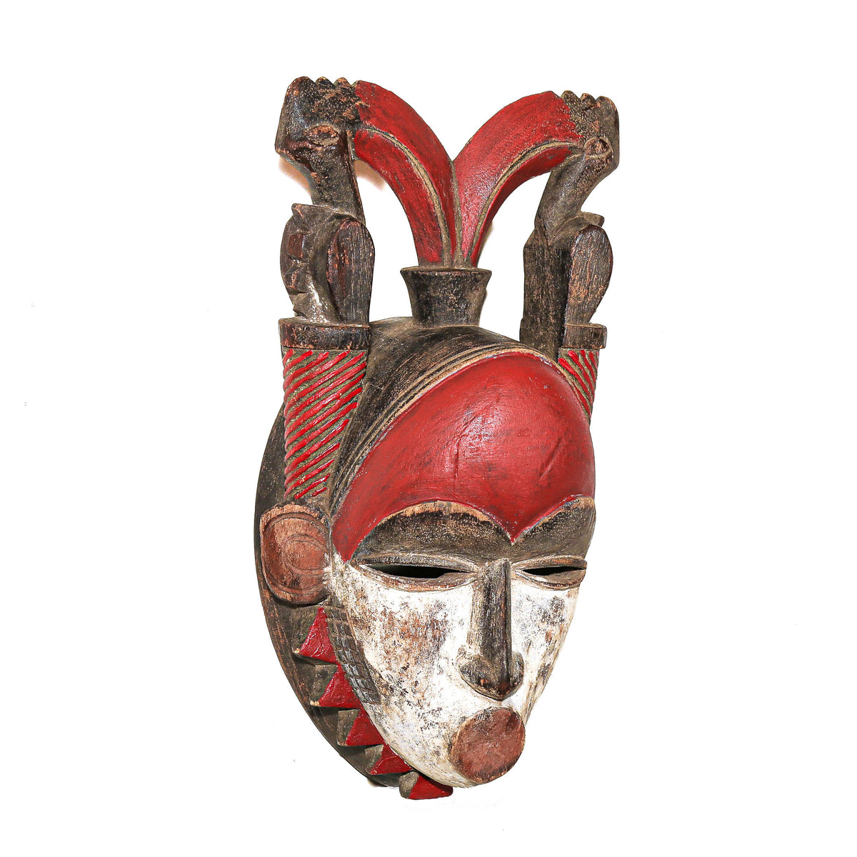Antique-style red painted Baule face mask from Côte d’Ivoire, West Africa