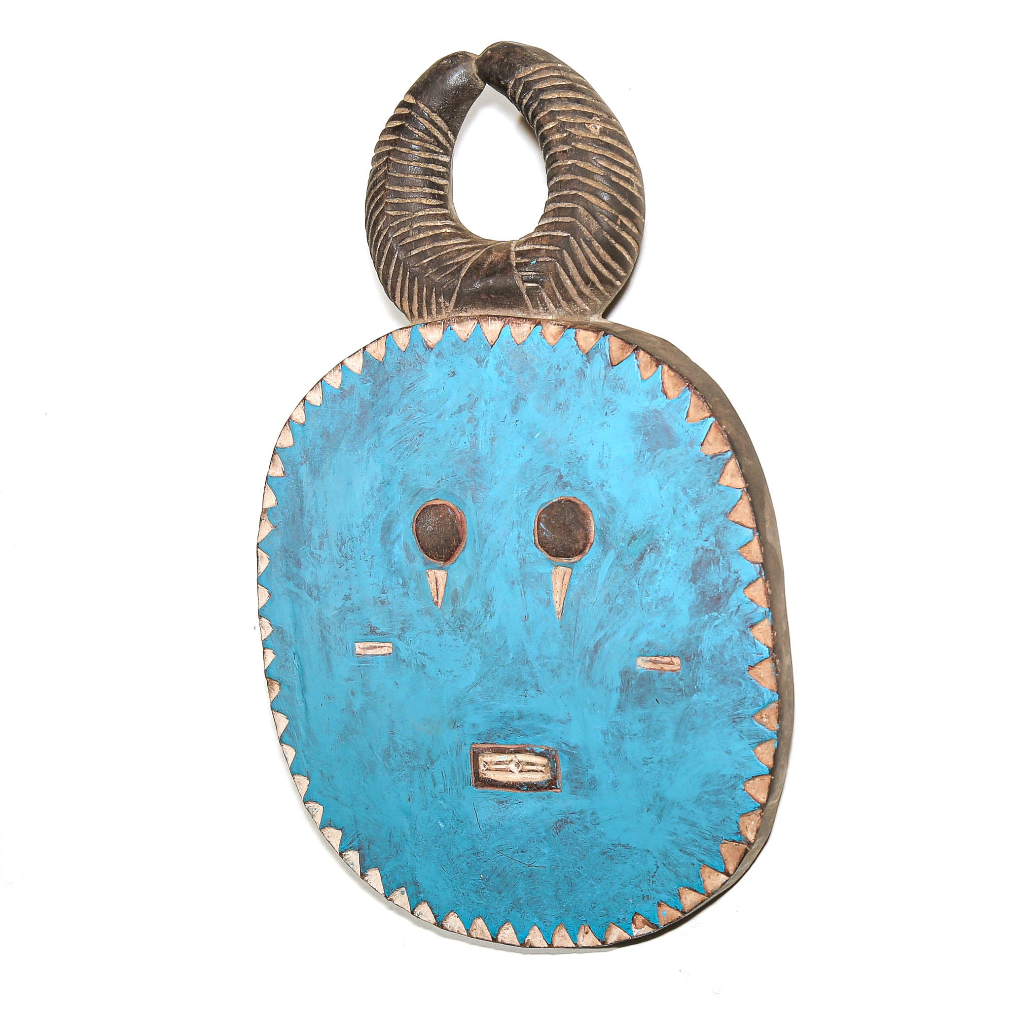 A traditional African wooden mask with a vibrant turquoise blue face, hand-painted details, and a dark brown horn-like loop at the top, shown against a plain white background.