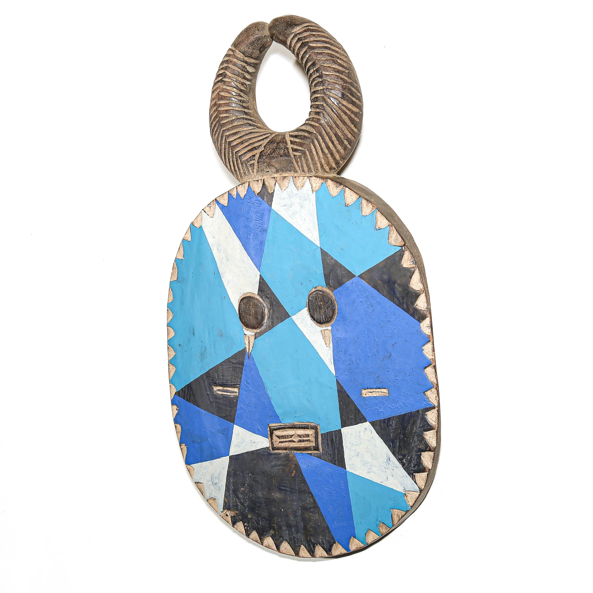 A carved wooden mask pendant with a geometric inlay pattern in blue, black, and white, featuring a textured brown loop at the top, shown against a plain white background.