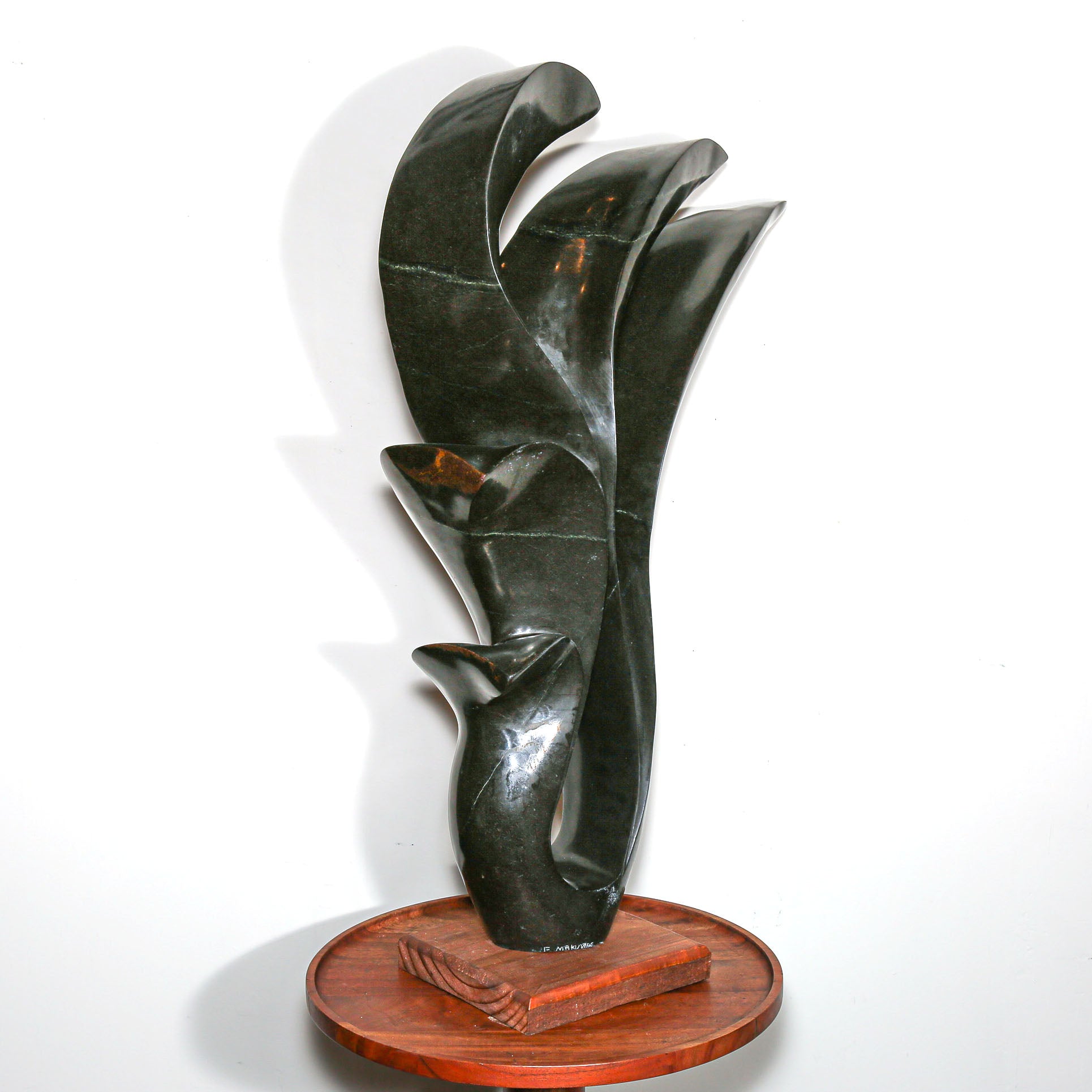 signed modern african sculpture in black stone