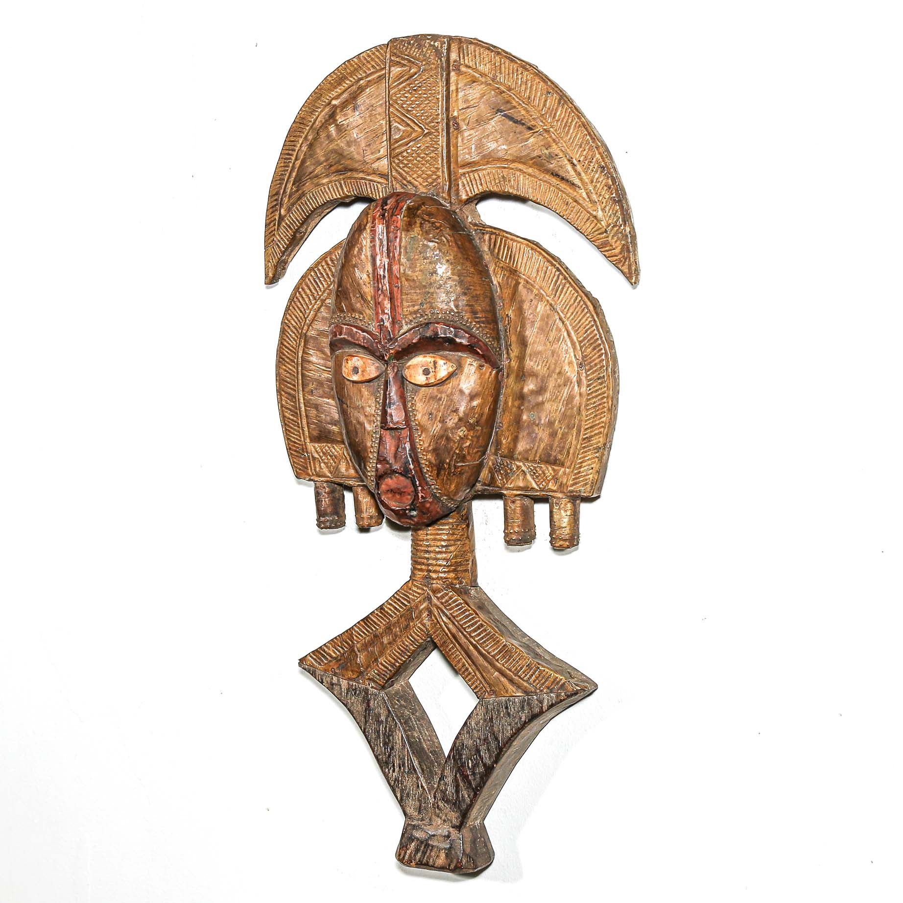 Traditional Kota ancestor guardian sculpture from Gabon with geometric face and metal covering