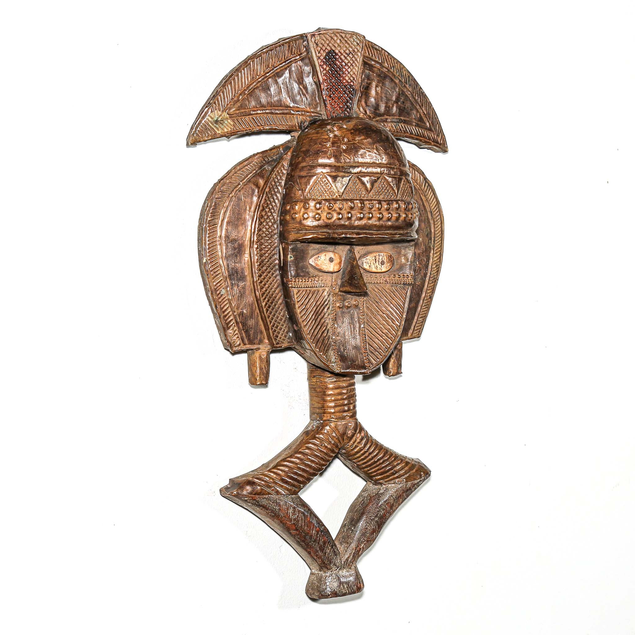 Side view of fine African Kota guardian sculpture from Gabon with metal overlay