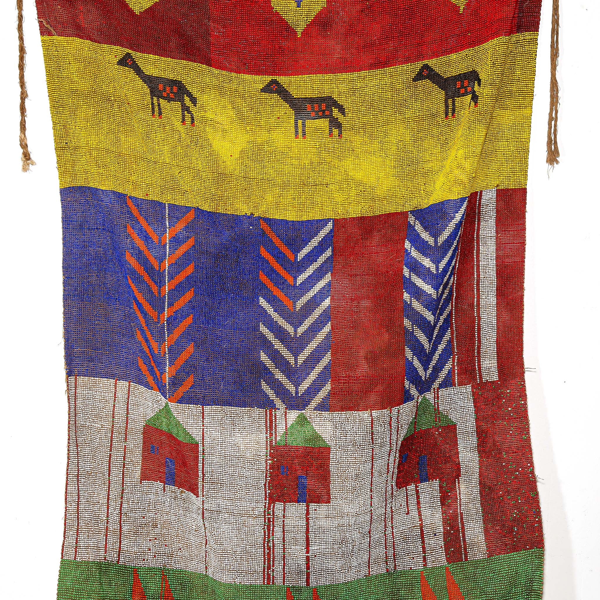 Colorful textile with geometric patterns and animal illustrations on a white background