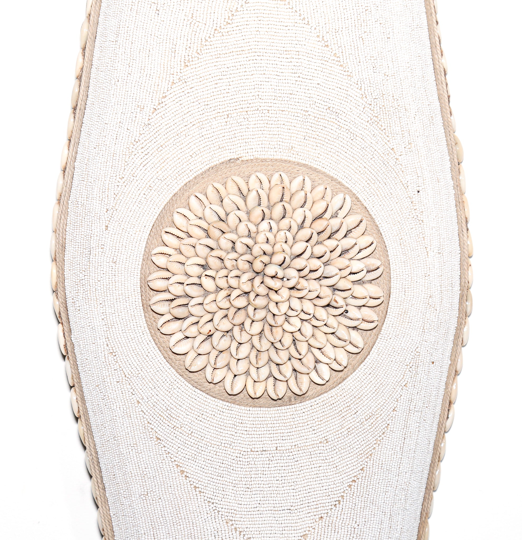 long white shield with white beads and cowrie shells from Cameroon. African Wall art for sale at Hemingway Gallery