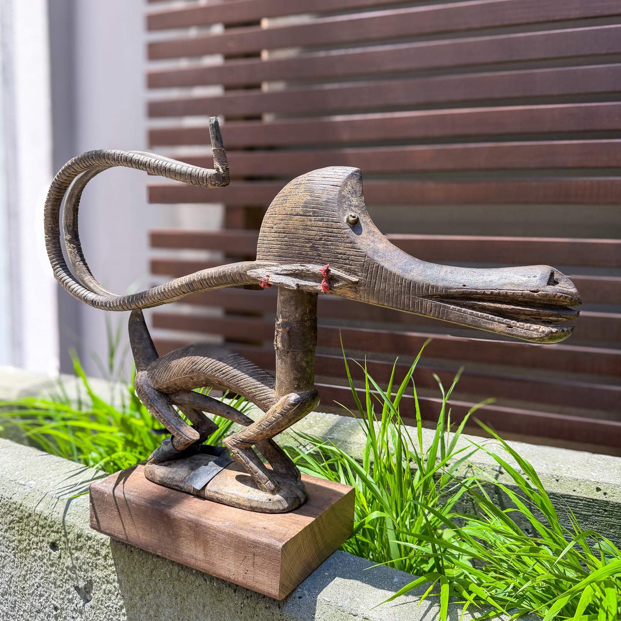 Rear view of horizontal Chiwara headdress showing curved tail and horns