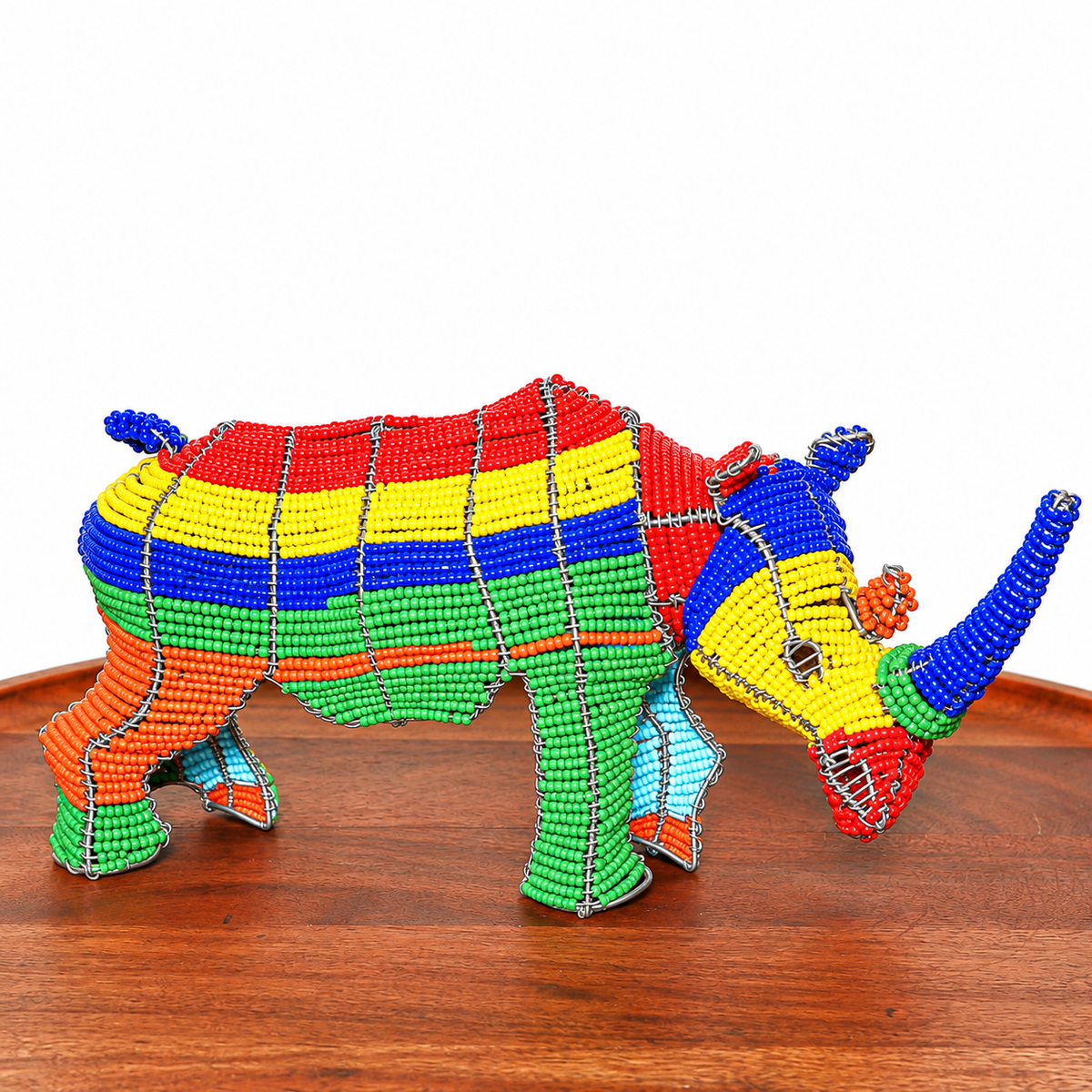South African beaded wire rhino sculpture displayed as small handmade African animal art for shelf or tabletop decor