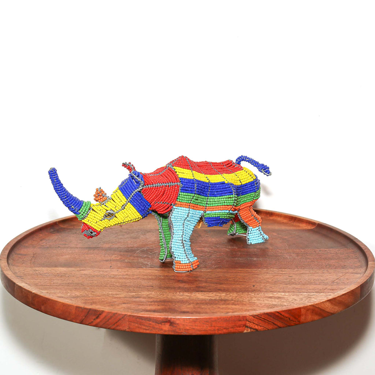 Colorful beaded rhinoceros figurine handmade in South Africa with wrapped wire construction and intricate bead details