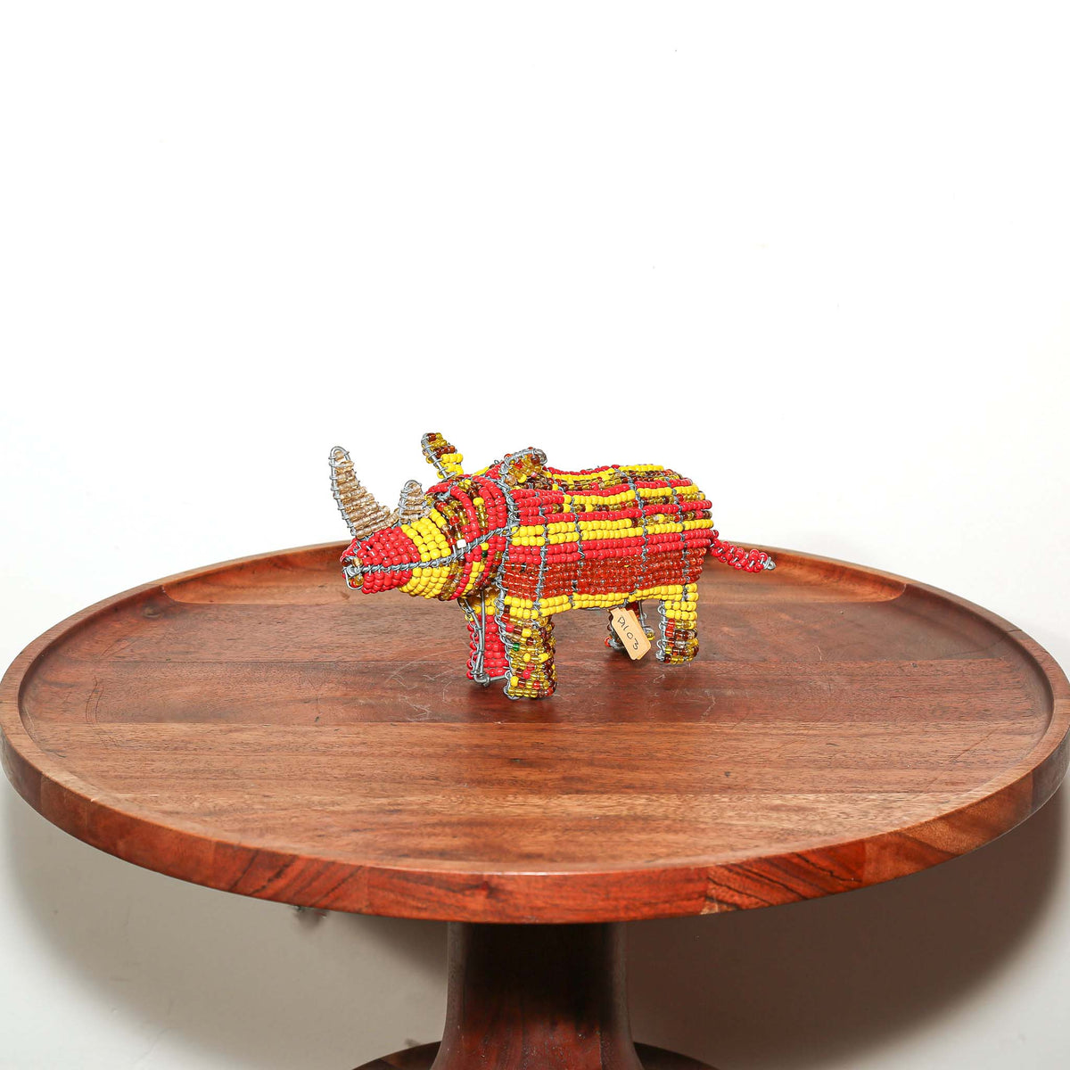 Miniature African rhino figurine handcrafted from beads and wire by artists in South Africa