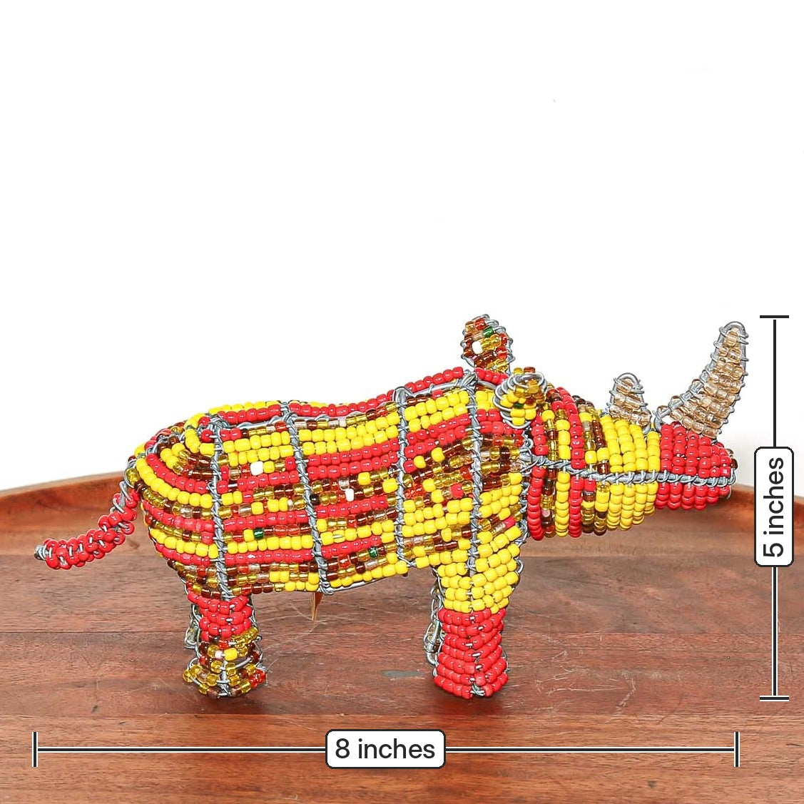 Mini beaded rhino sculpture handmade in South Africa, featuring colorful beads wrapped around a sculptural wire frame