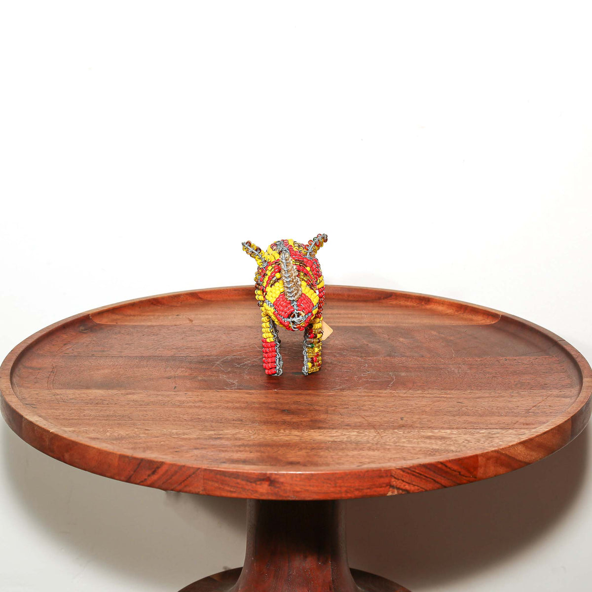 Small handmade beaded rhinoceros sculpture from South Africa with intricate wirework and colorful decorative beads