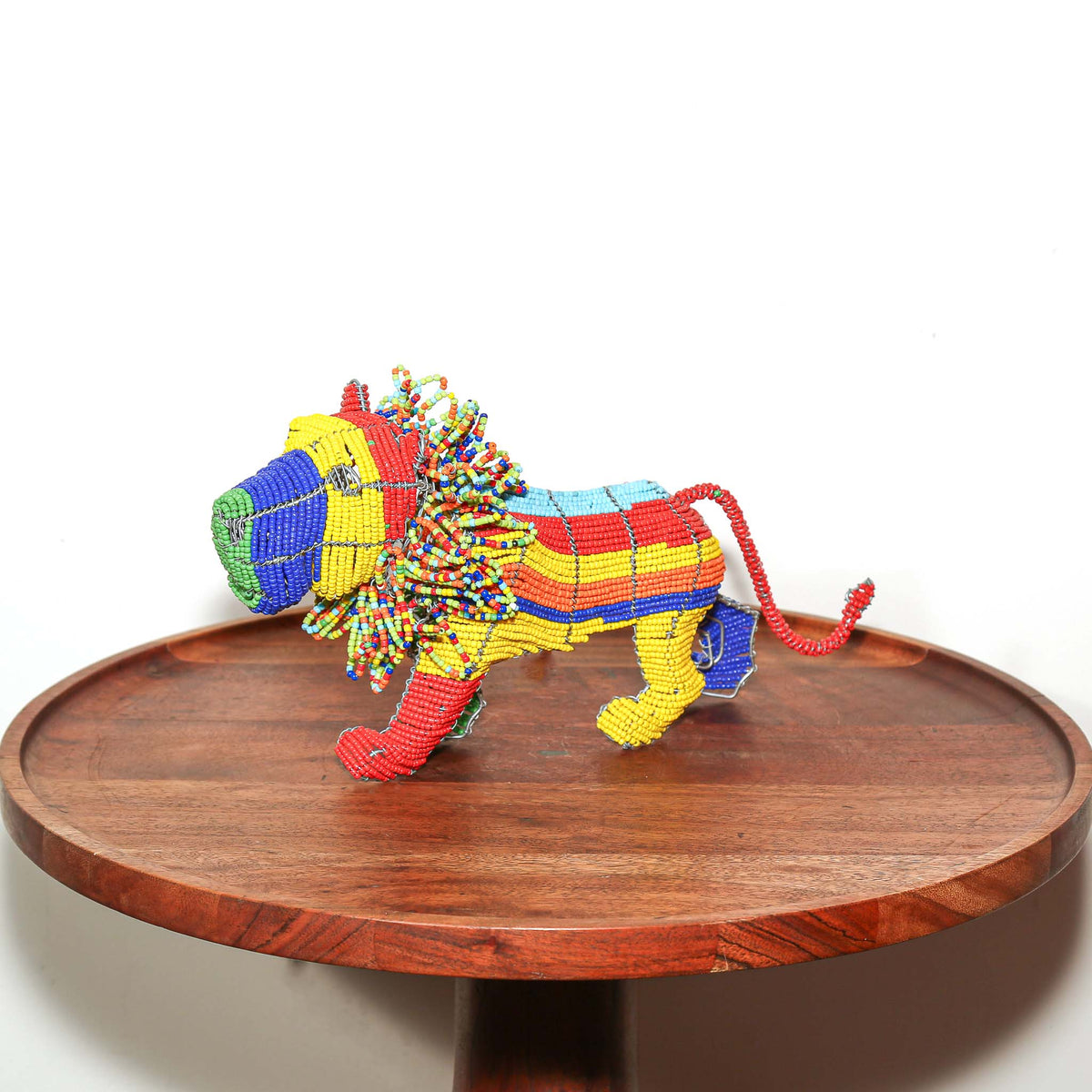 Small African lion figurine handcrafted from colorful beads and wire by artists in South Africa