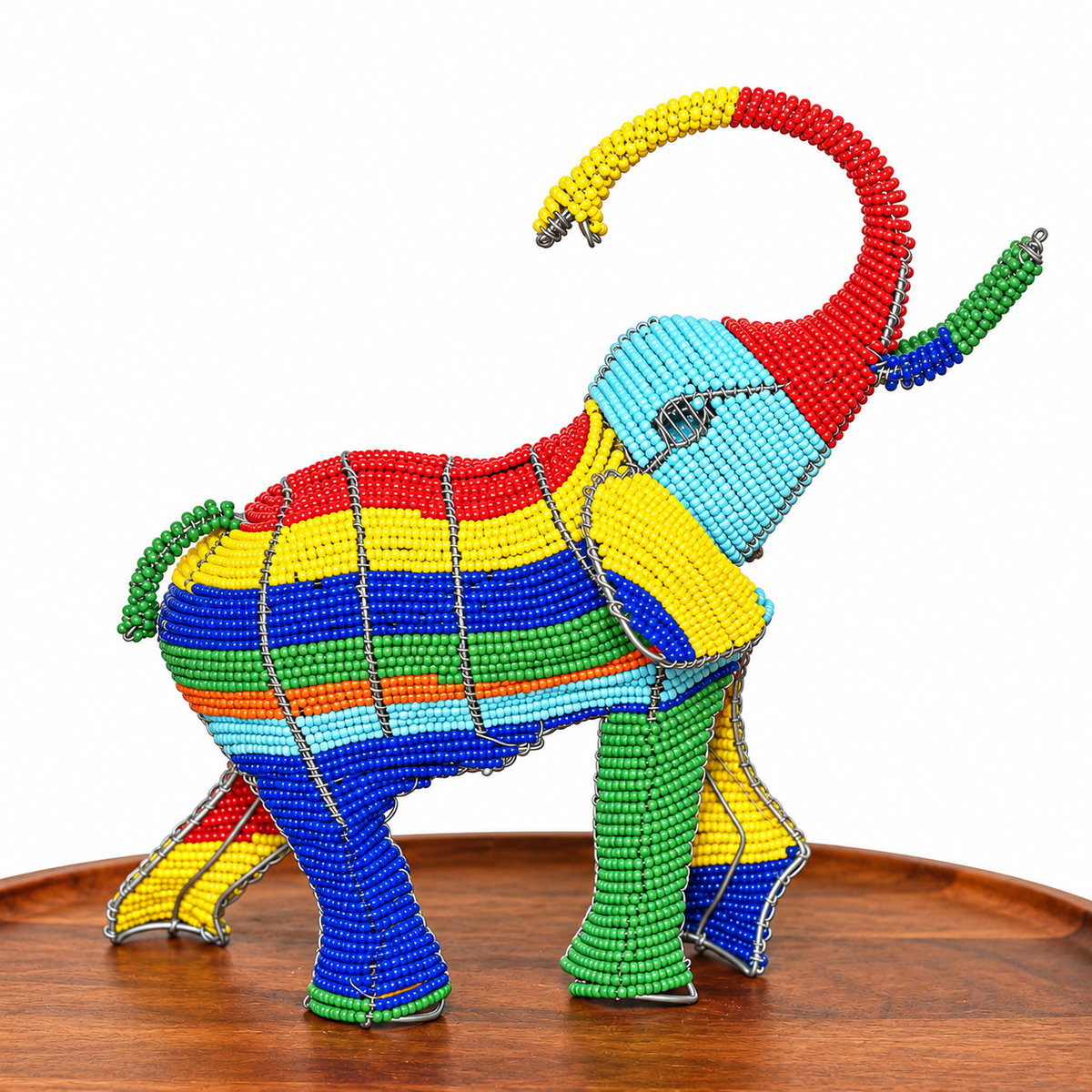 Colorful beaded elephant figurine handcrafted in South Africa with detailed wire shaping and vibrant decorative texture