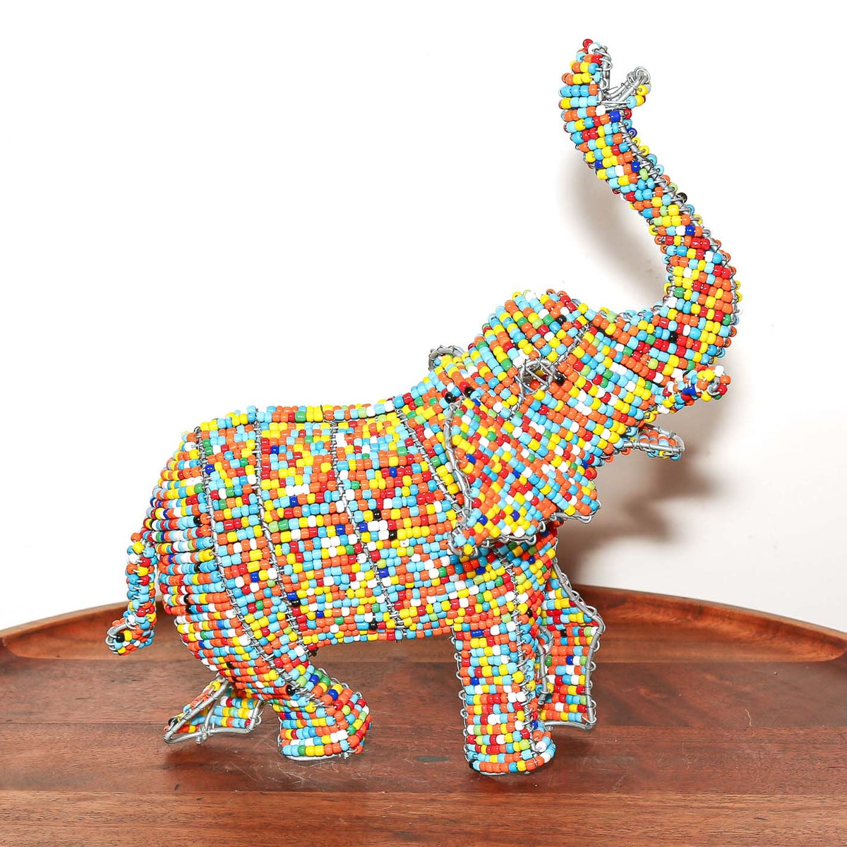 Handmade African elephant figurine made with wire and vibrant beads, designed as a small collectible art sculpture