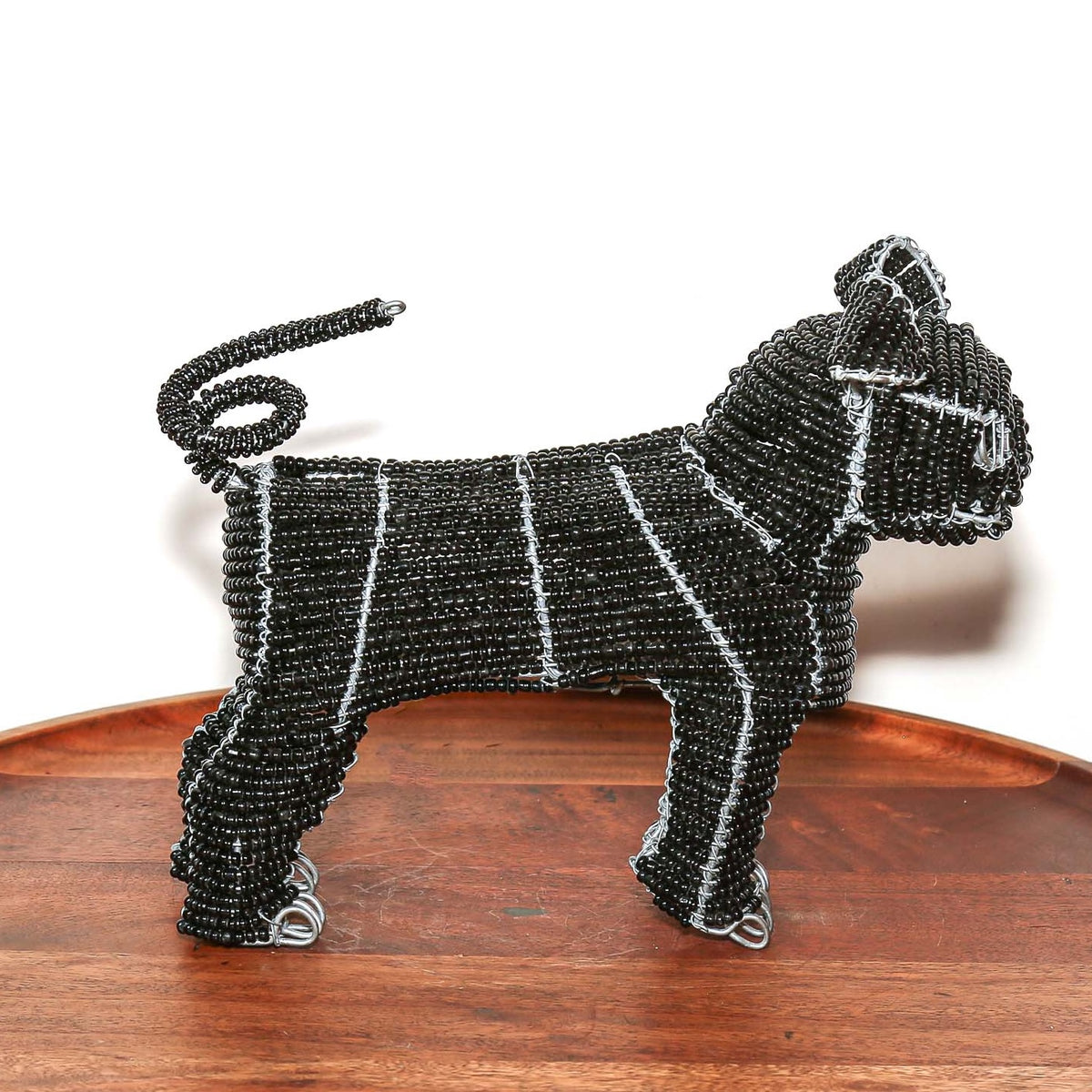 Handmade black beaded pug sculpture from South Africa with expressive form, artisan beadwork, and compact home decor appeal