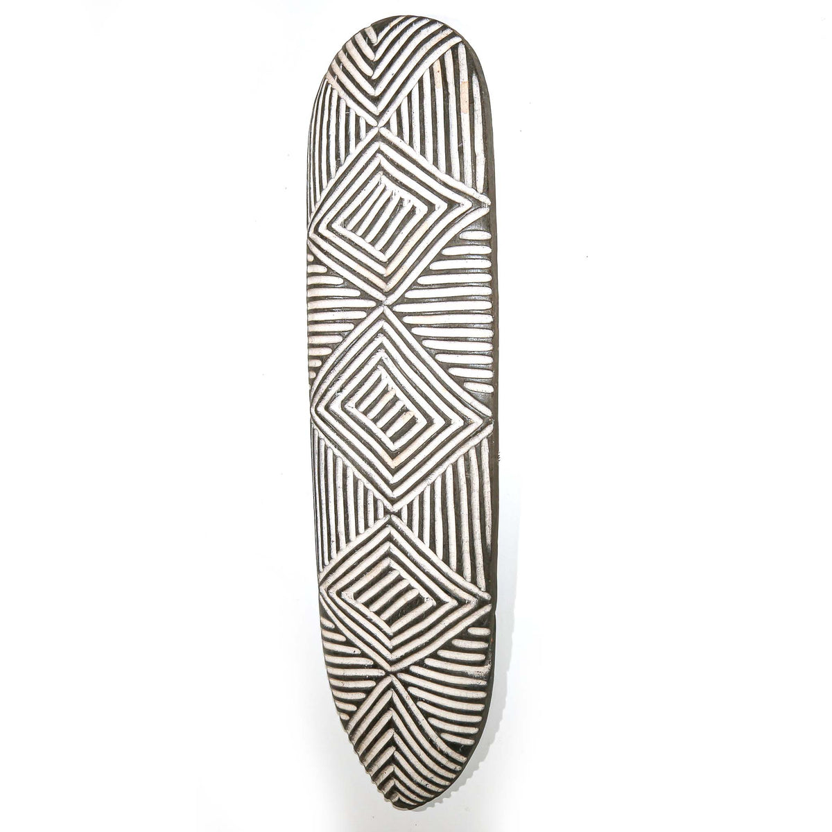 High-quality Cameroon wall shield featuring an elongated form, black and white decoration, and sculptural African design