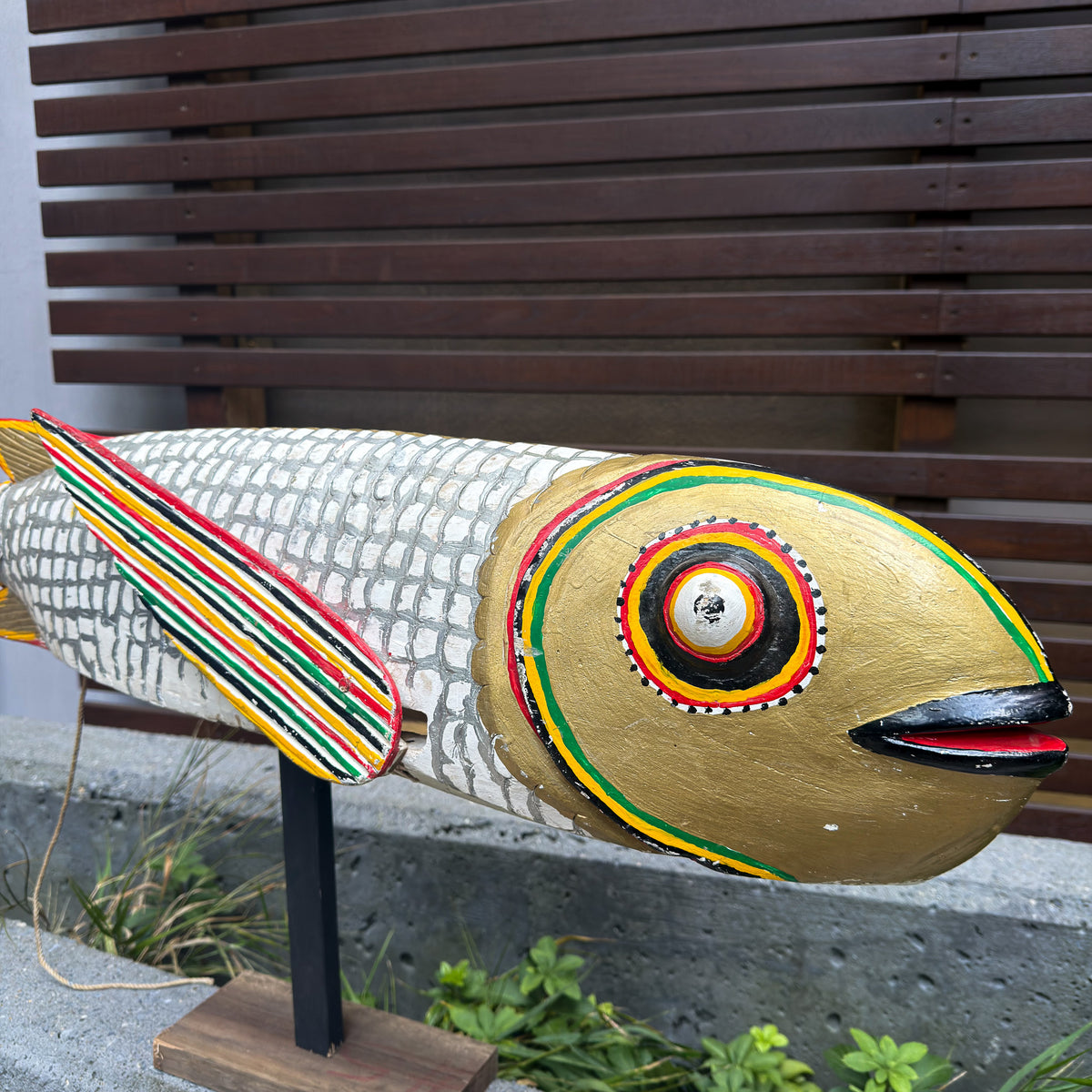 Large white African fish sculpture puppet with articulated construction and striking sculptural character