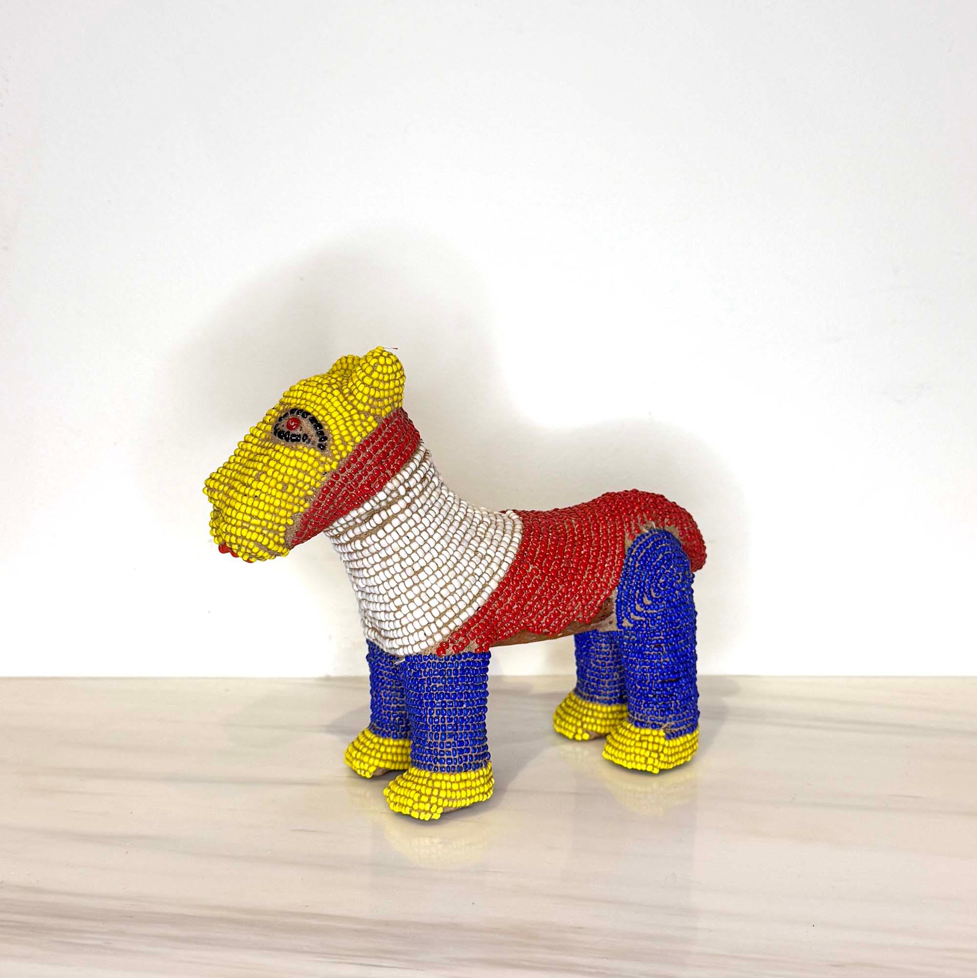 Beaded Terracotta Bamileke Leopard Sculpture from Cameroon - Small on a table