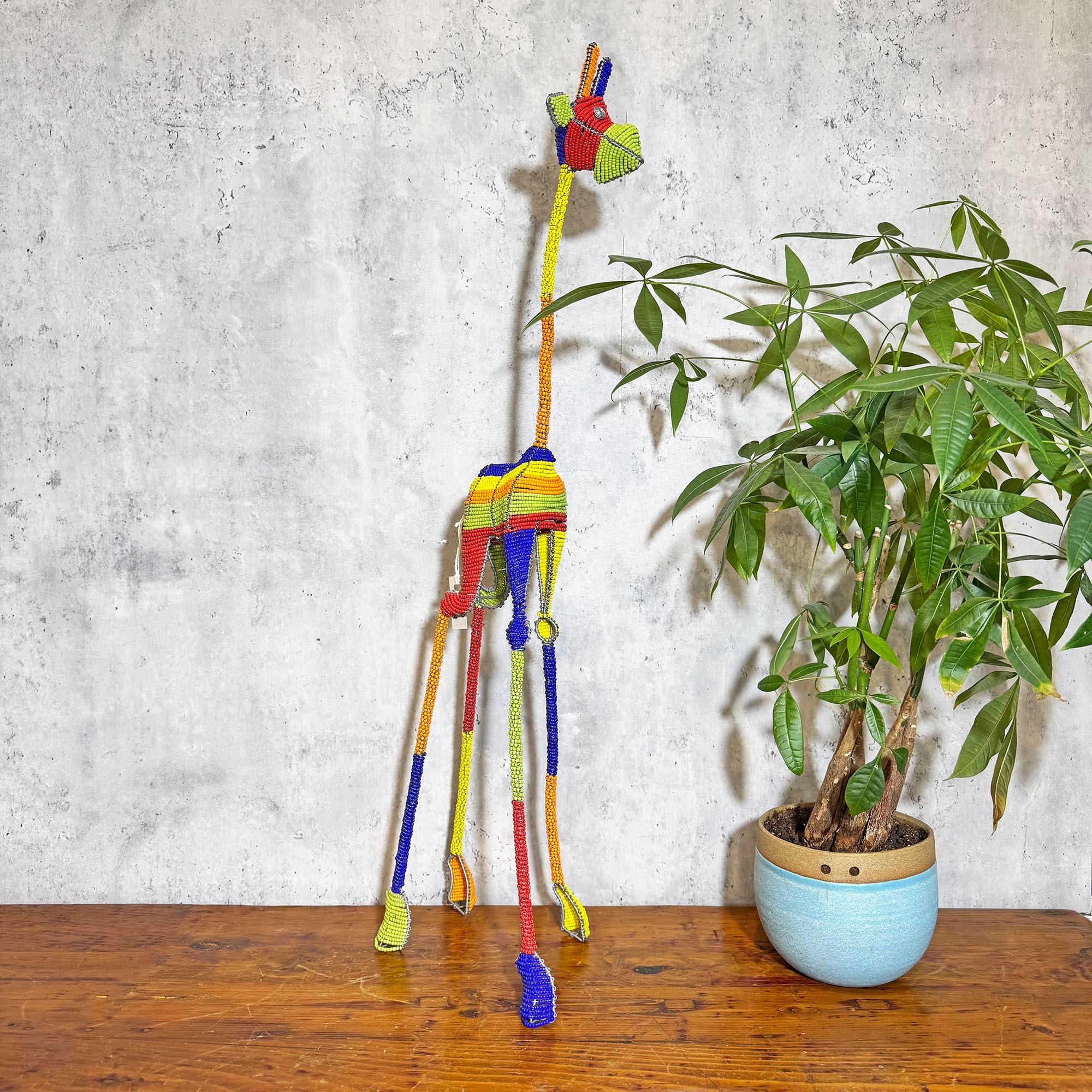 Handmade Beaded Giraffe Sculpture from South Africa decorating a house