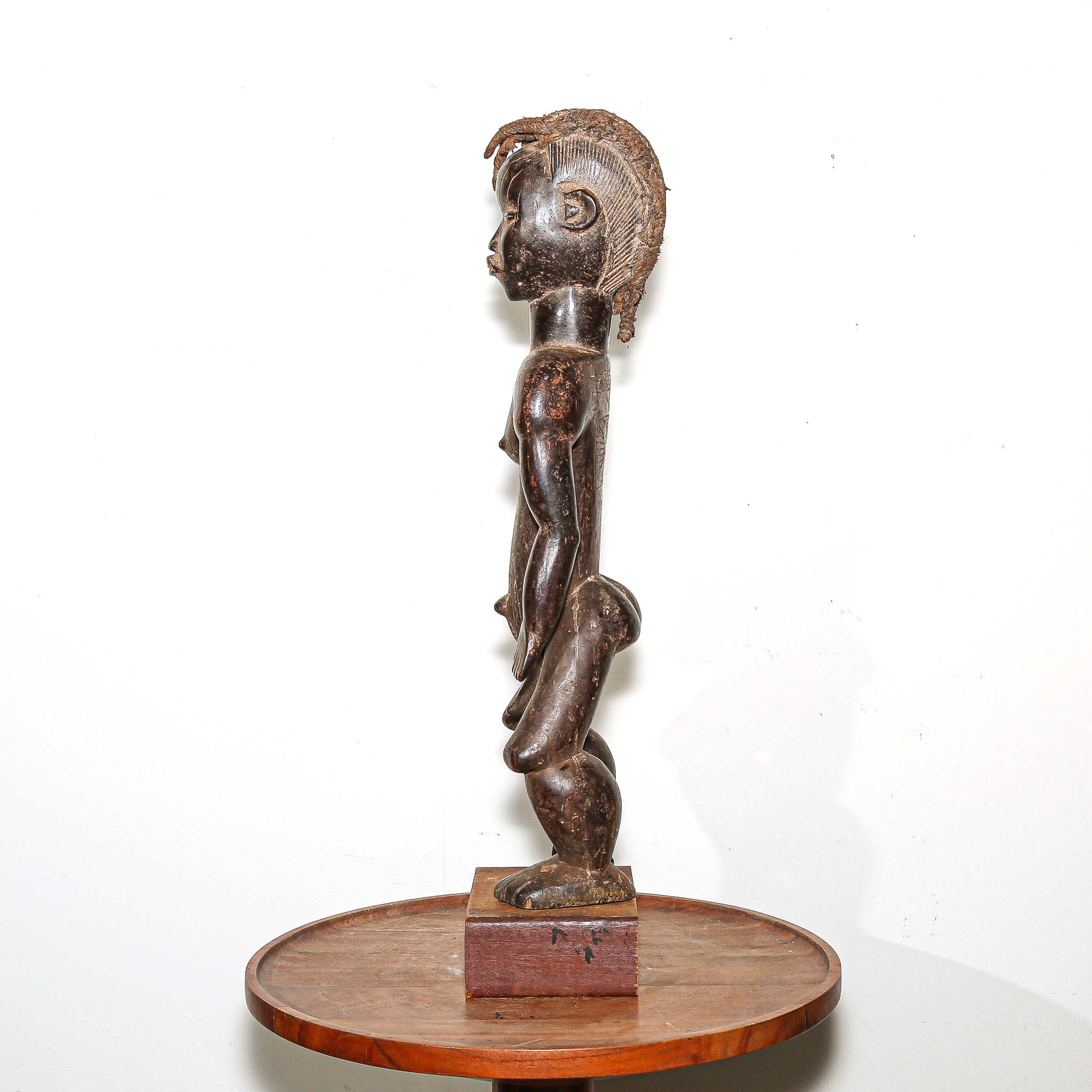 wooden male figure sculpture carved by the Dan people in Ivory Coast