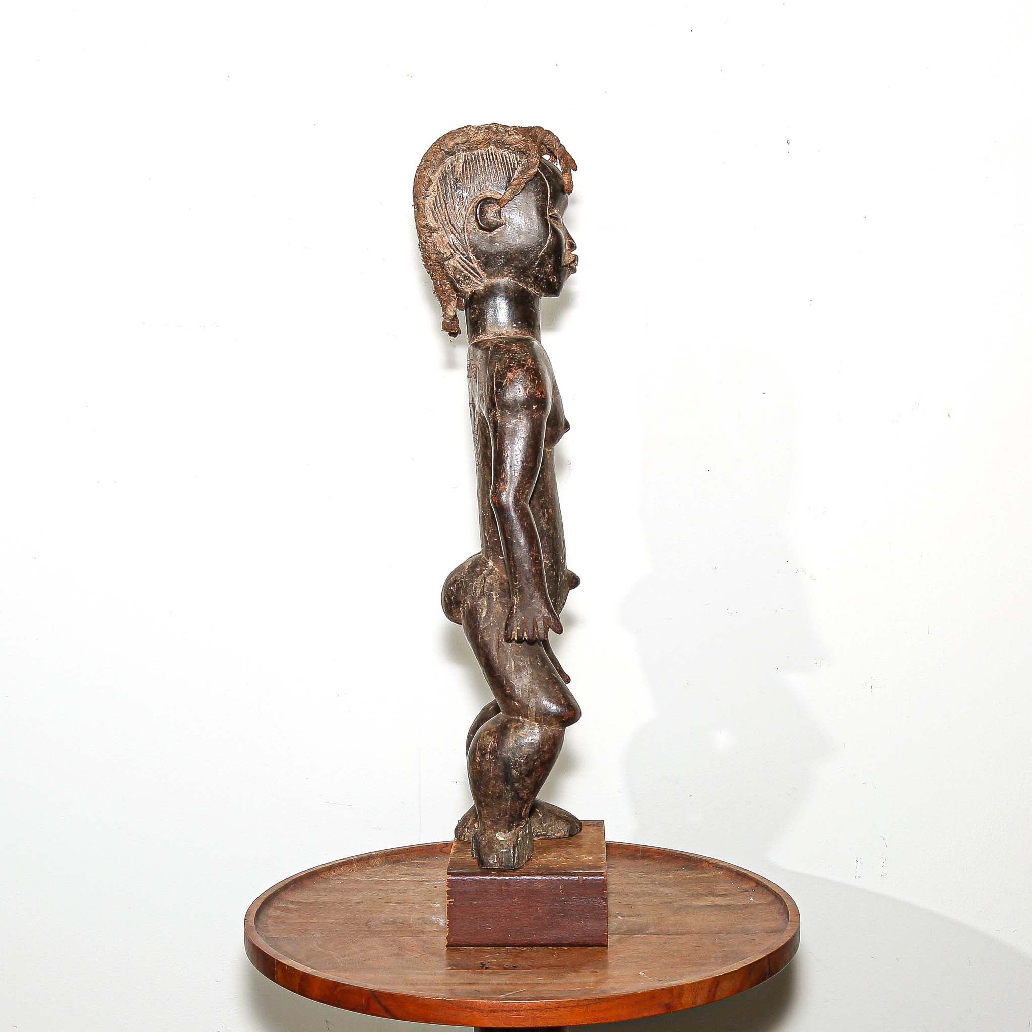 wooden male figure sculpture carved by the Dan people in Ivory Coast