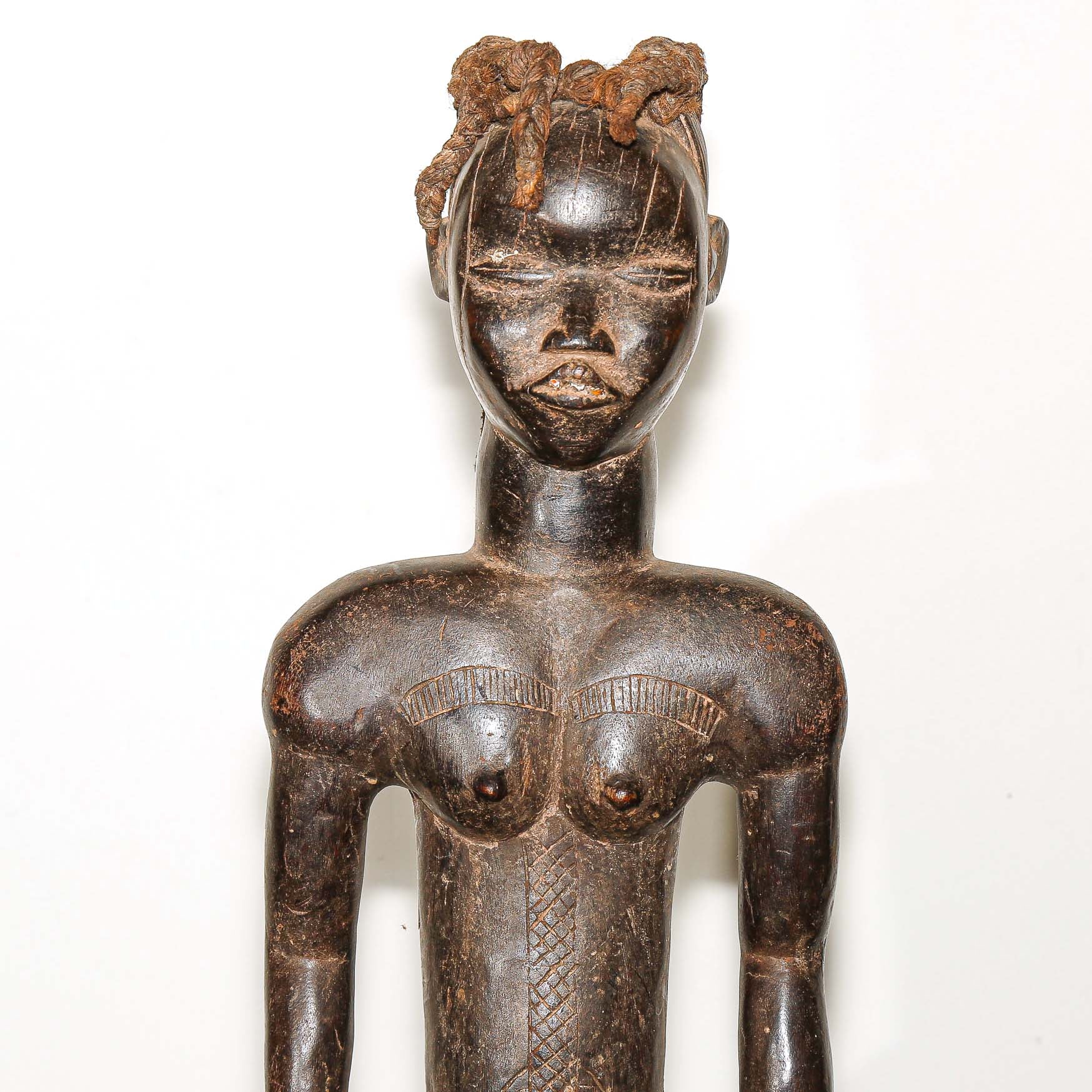 wooden male figure sculpture carved by the Dan people in Ivory Coast