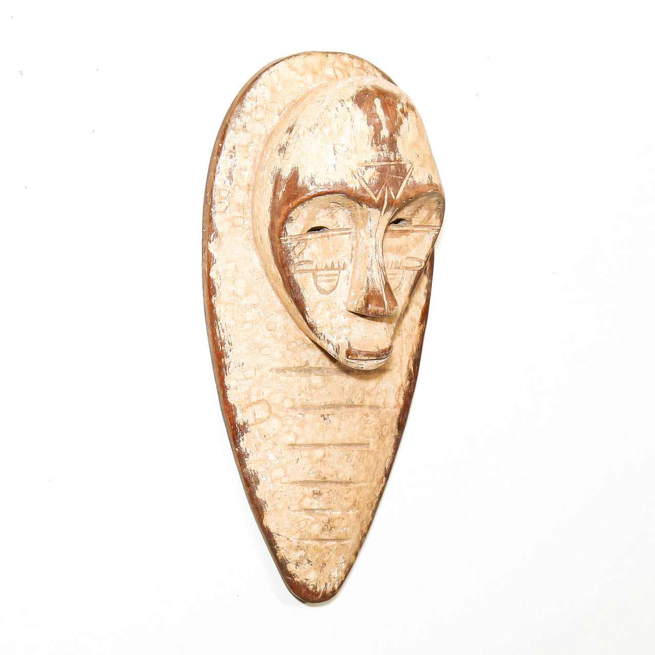 Decorative white Fang style mask displayed as African wall art