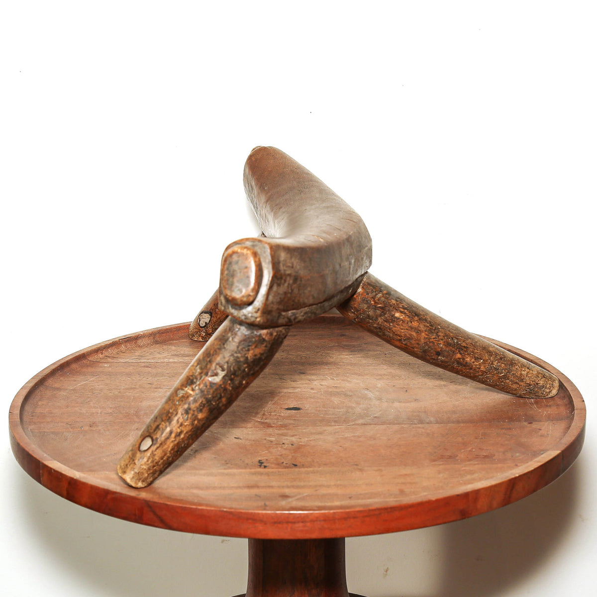Traditional Dinka wood headrest, South Sudan, showing smooth wear and deep natural patina