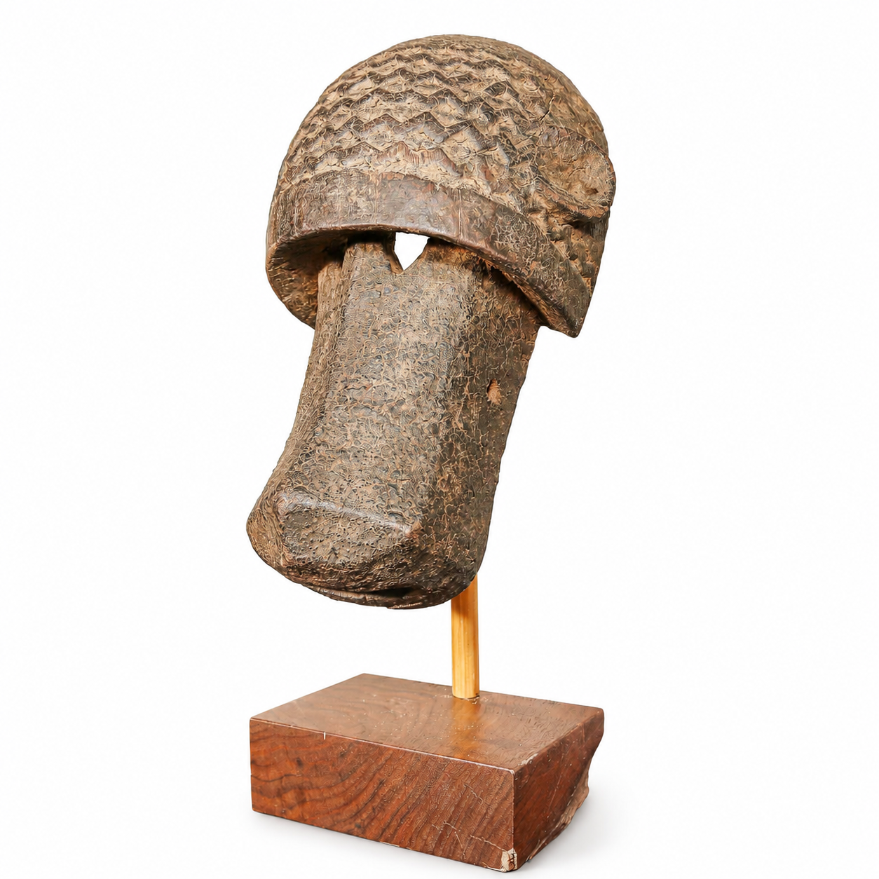 Dogon People from Mali hand carved mask for sale on wooden base with a white background
