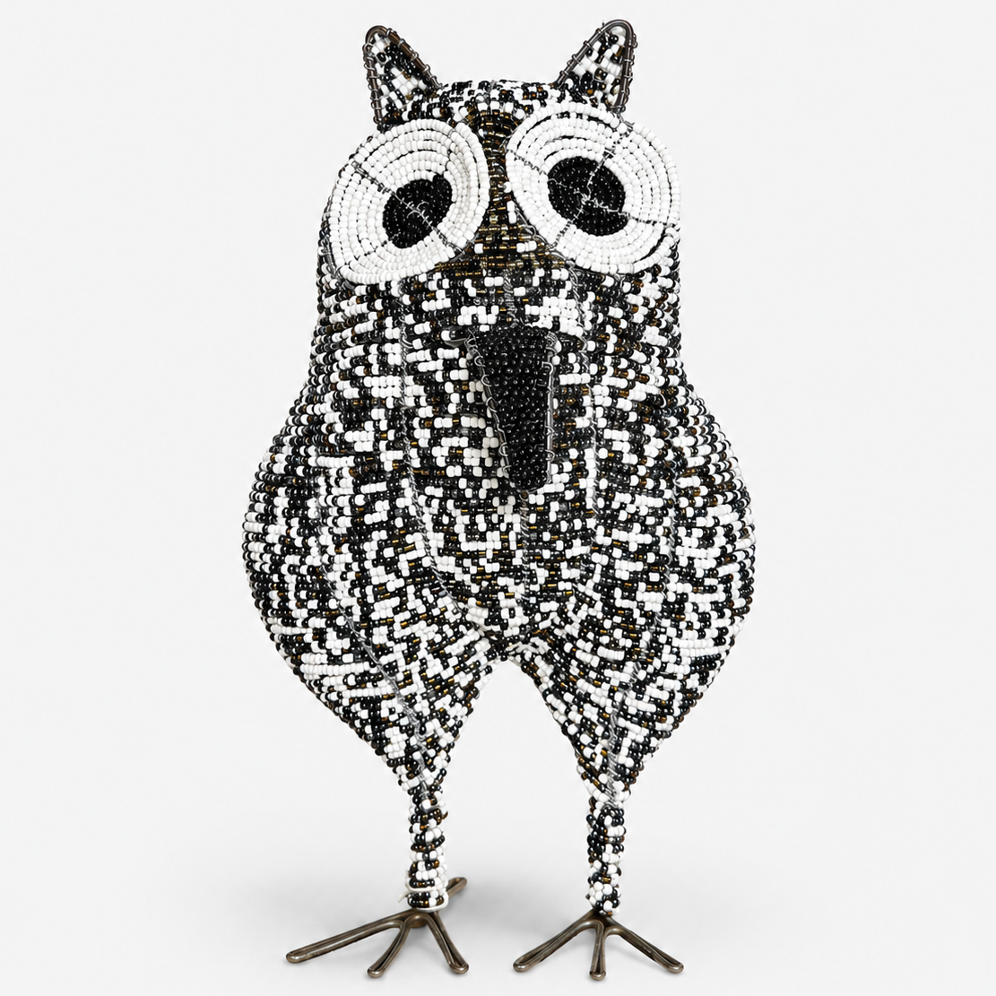 Decorative owl figurine with a black and white beads on a white background