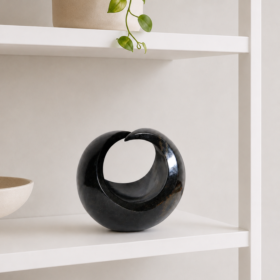 black African stone sculpture on a shelf