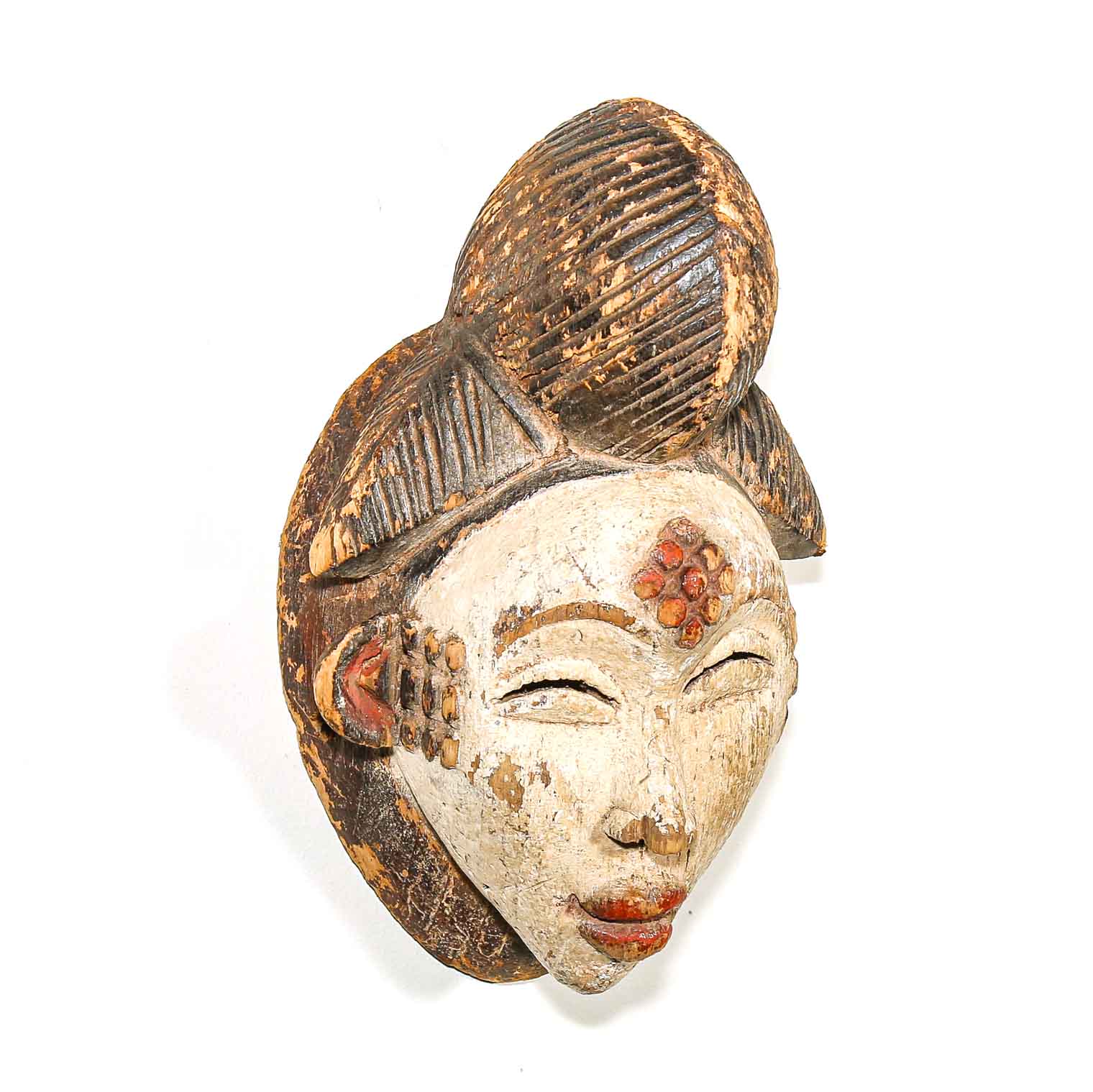 Decorative mask with intricate design on a white background