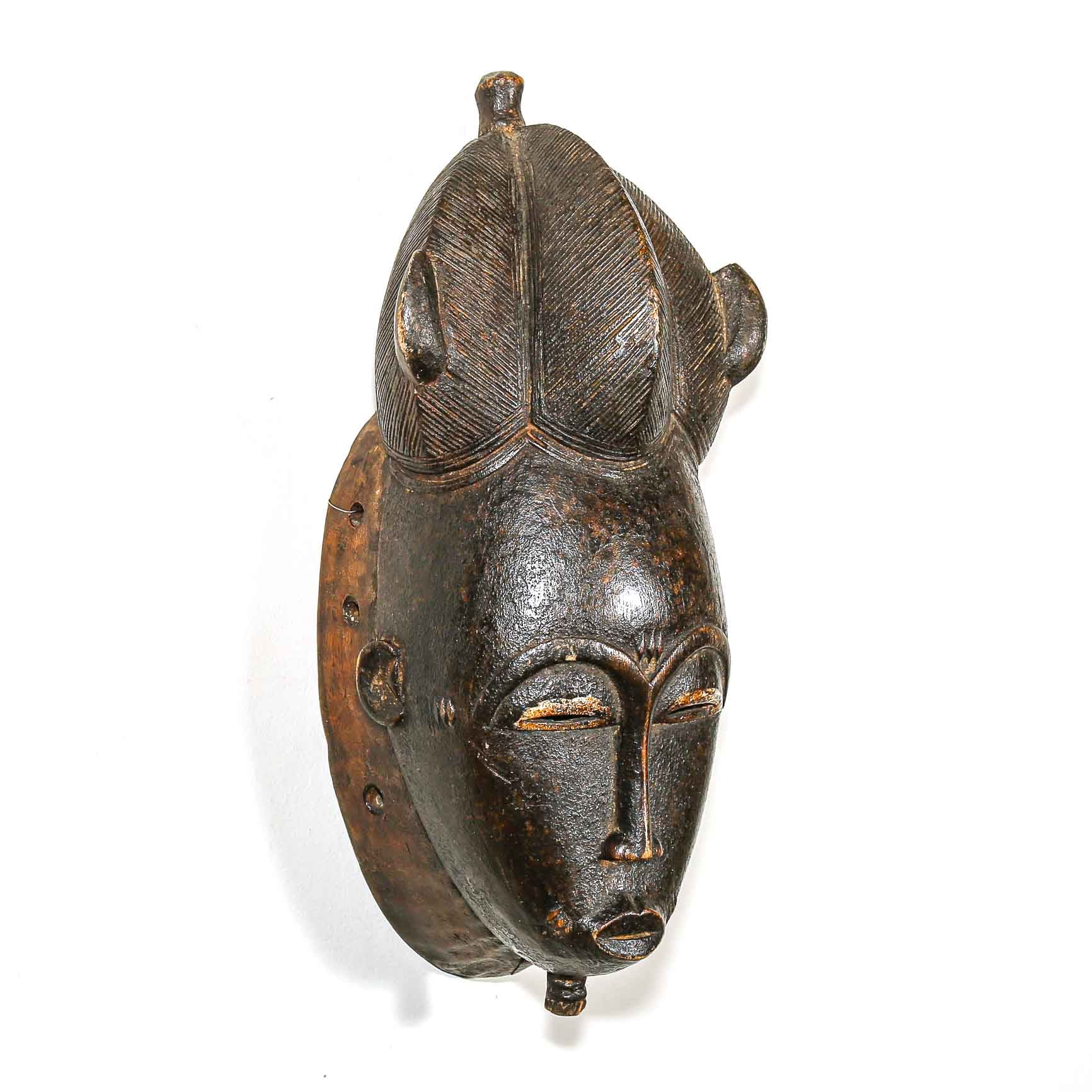 vintage black African mask on a white background