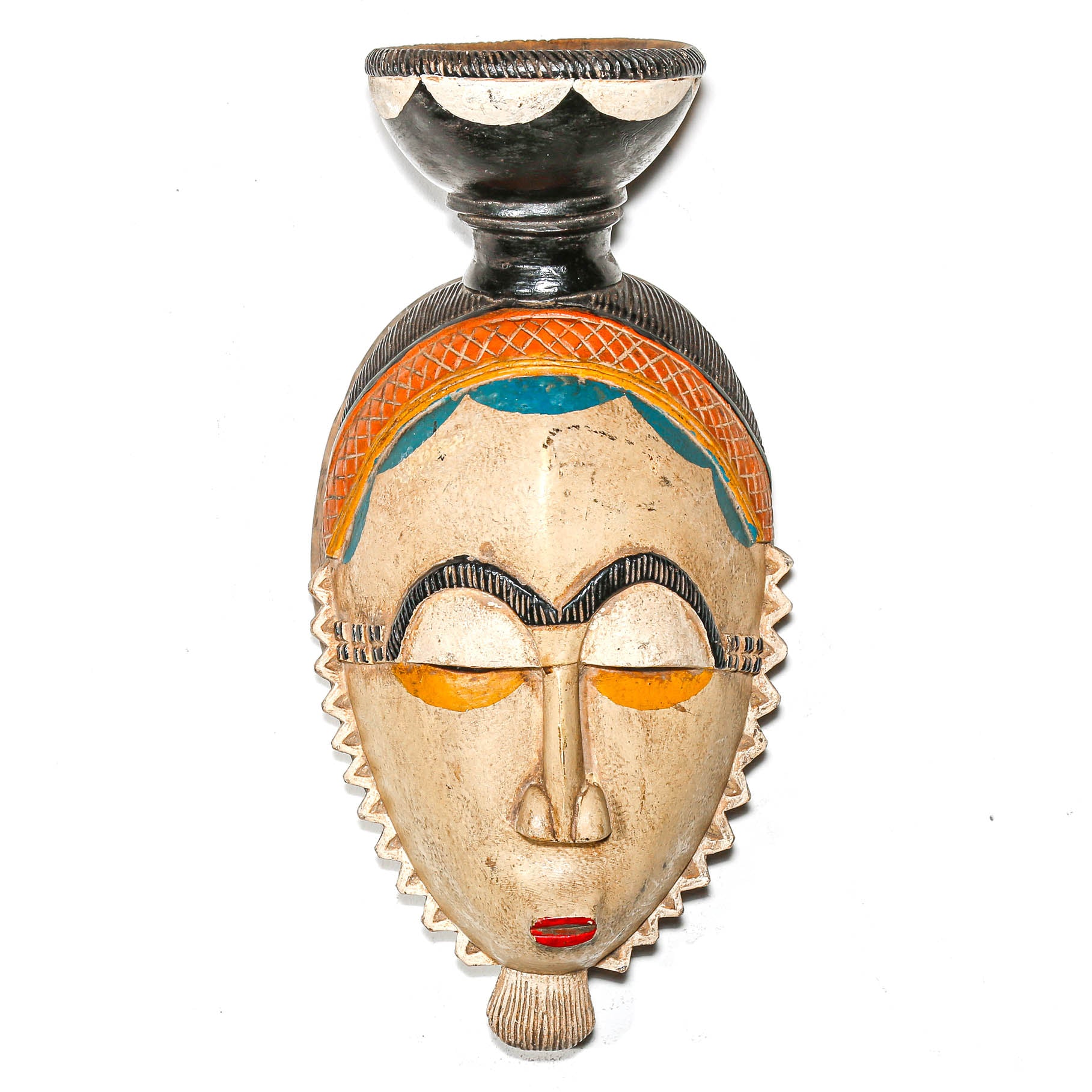 Rare African mask with colorful patterns on a white background