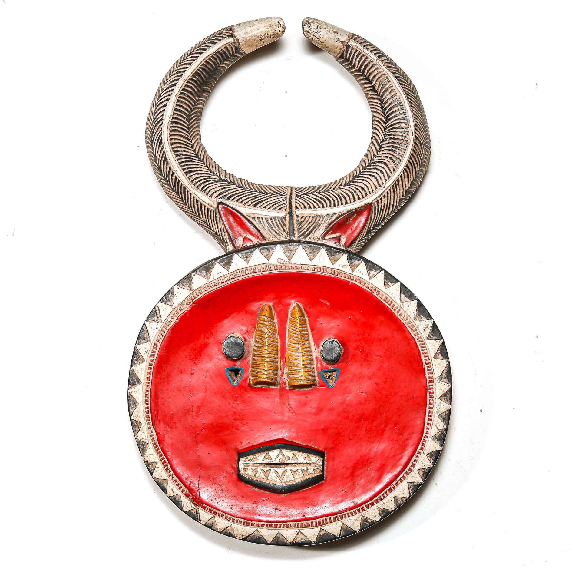 Decorative red shield with intricate silver and gold detailing on a white background