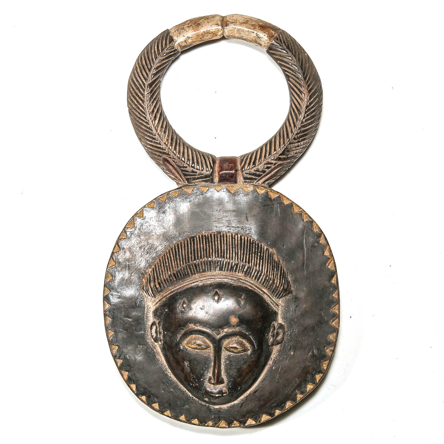 Decorative black African art mask with face design on a white background