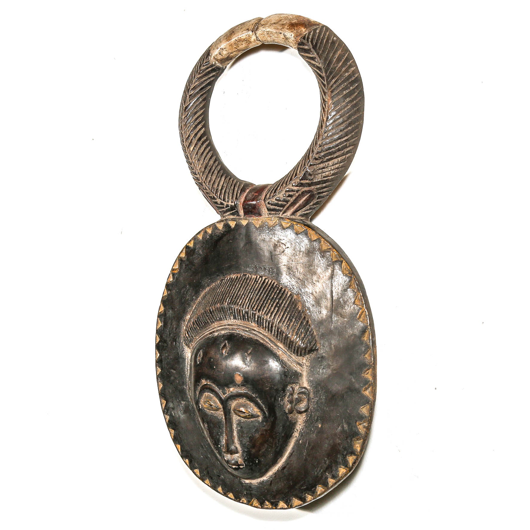 Decorative black African art mask with face design on a white background