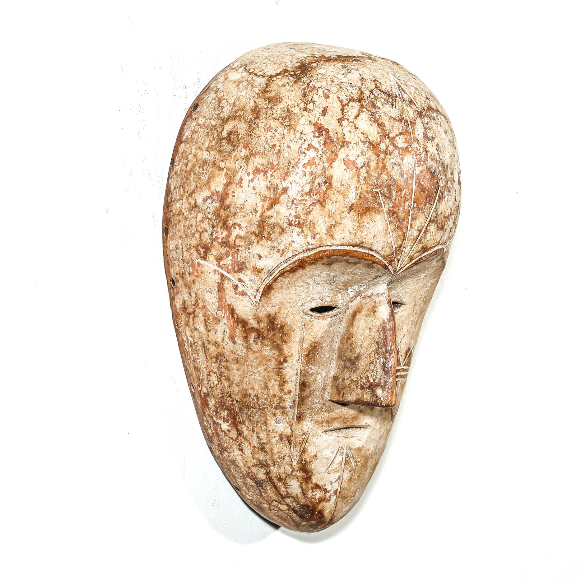 white color Carved African wooden mask on a white background