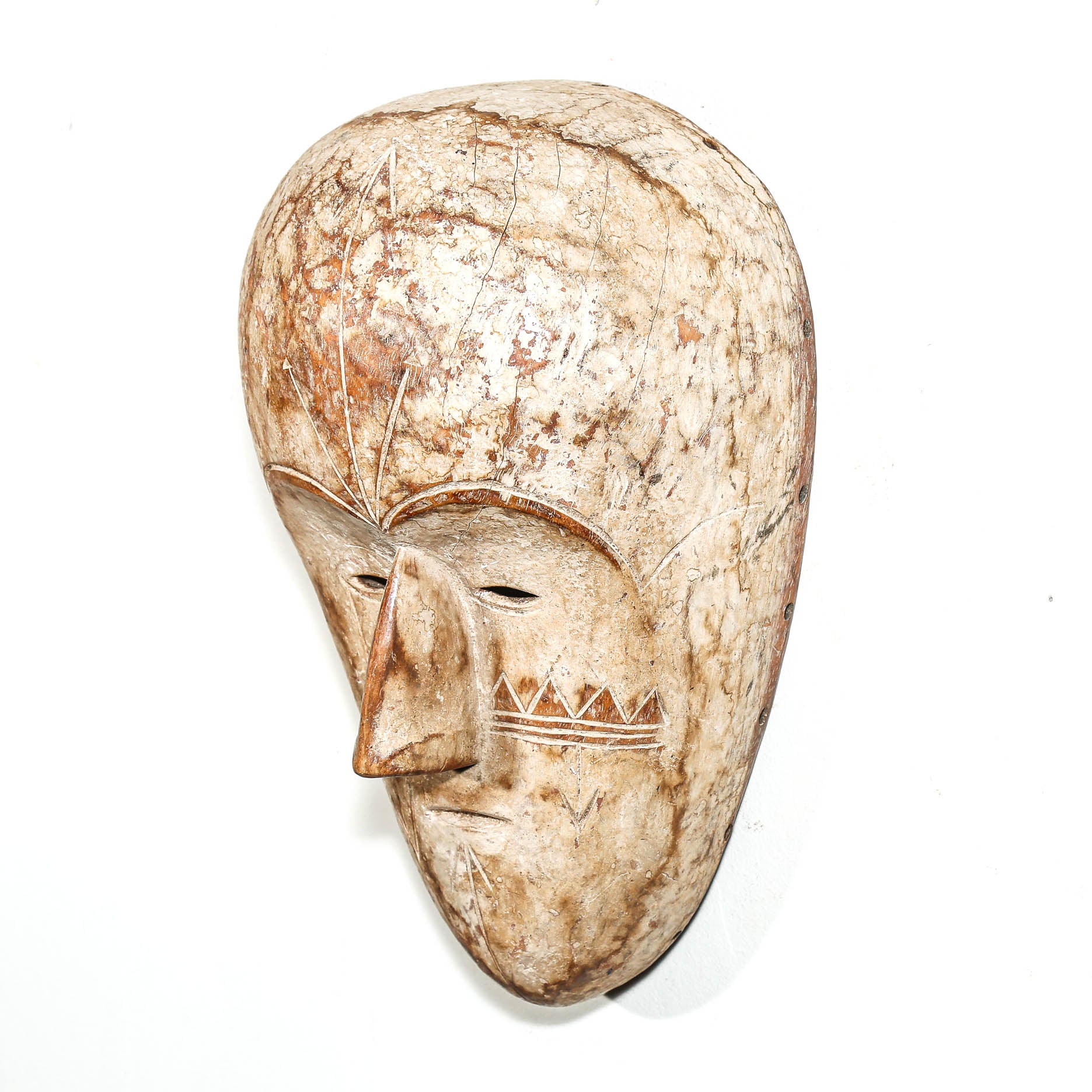 white color Carved African wooden mask on a white background