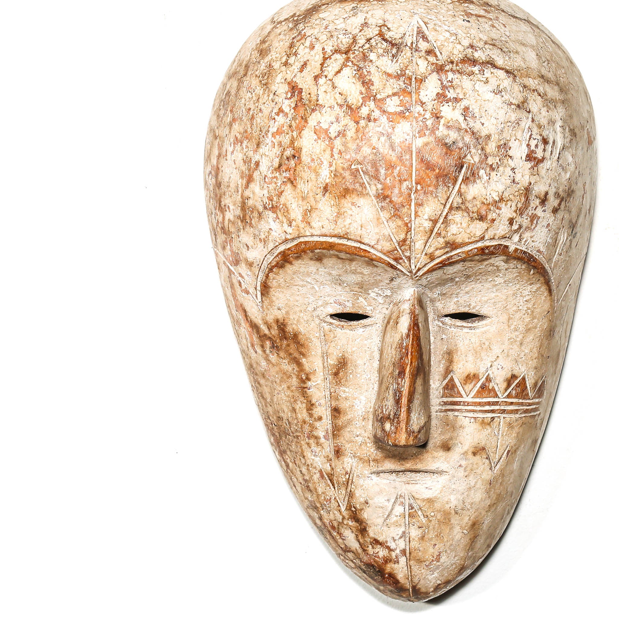 wall hanging Carved African wooden mask on a white background