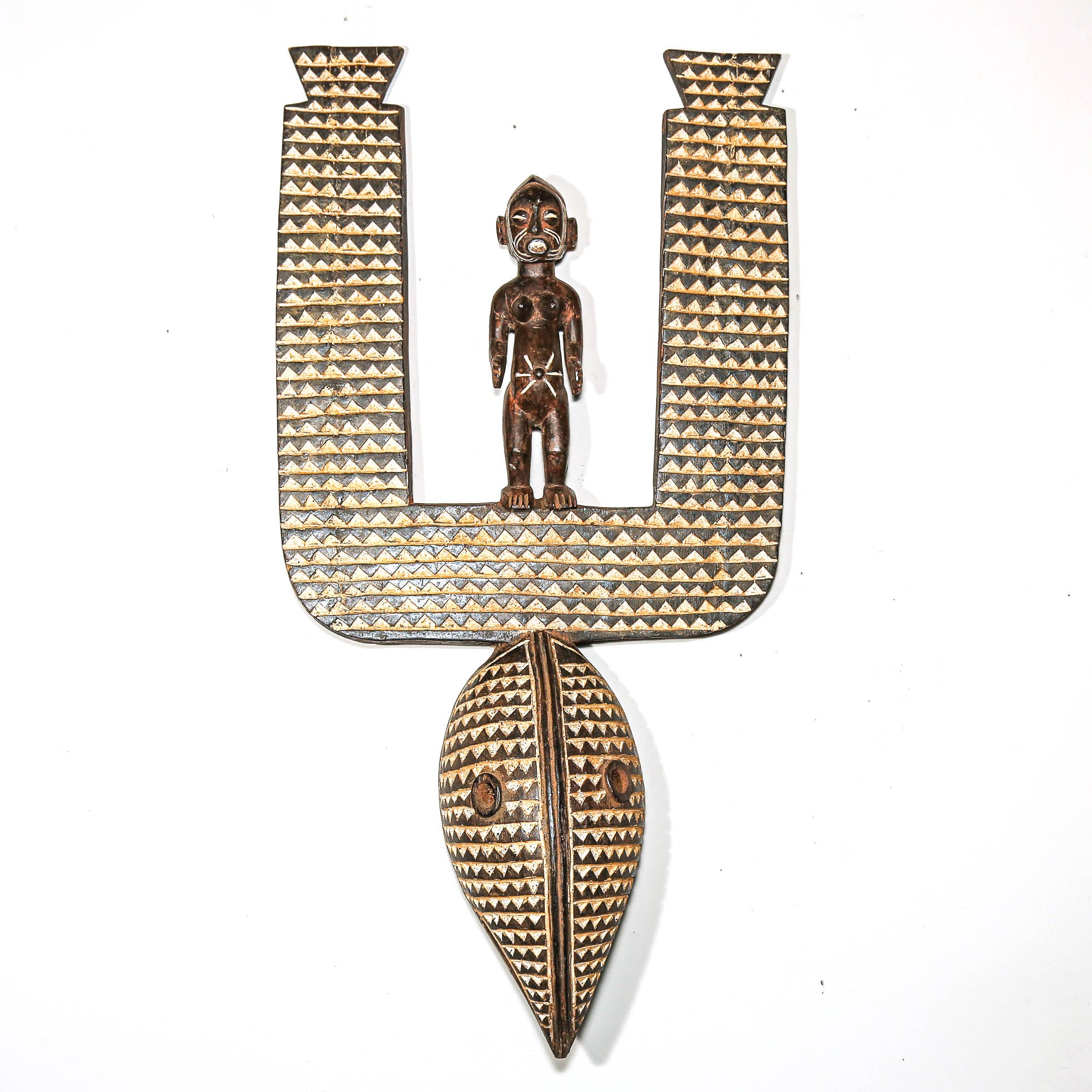 Decorative wall art with geometric patterns and a central figure on a white background African decor